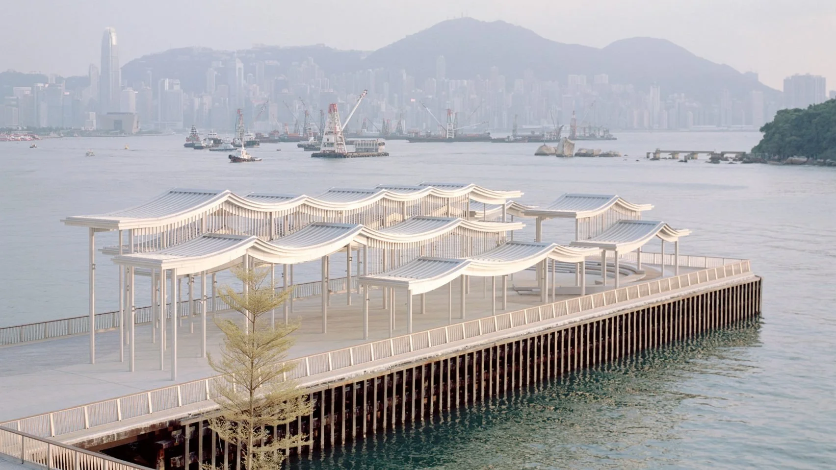 New Office Works shelters Hong Kong pier with undulating steel canopy