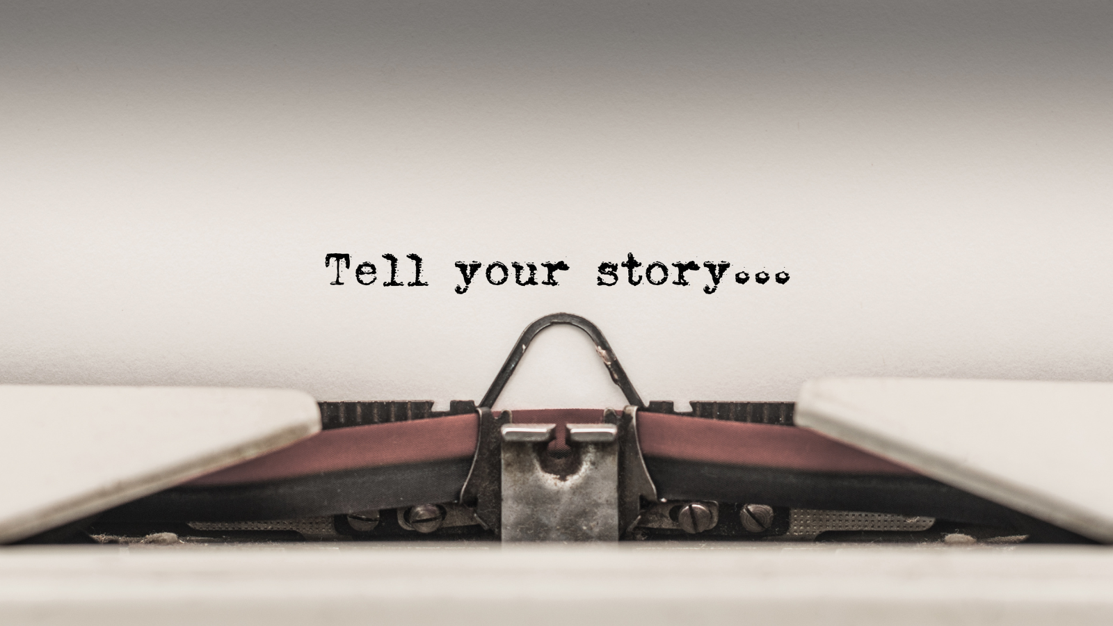 An image with a type writer with 'tell your story...' in text to represent the stories that you are able to tell from your archive.