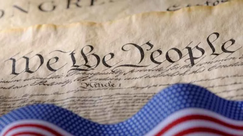 Image showing the american flag with a manuscript with 'we the people' written on it
