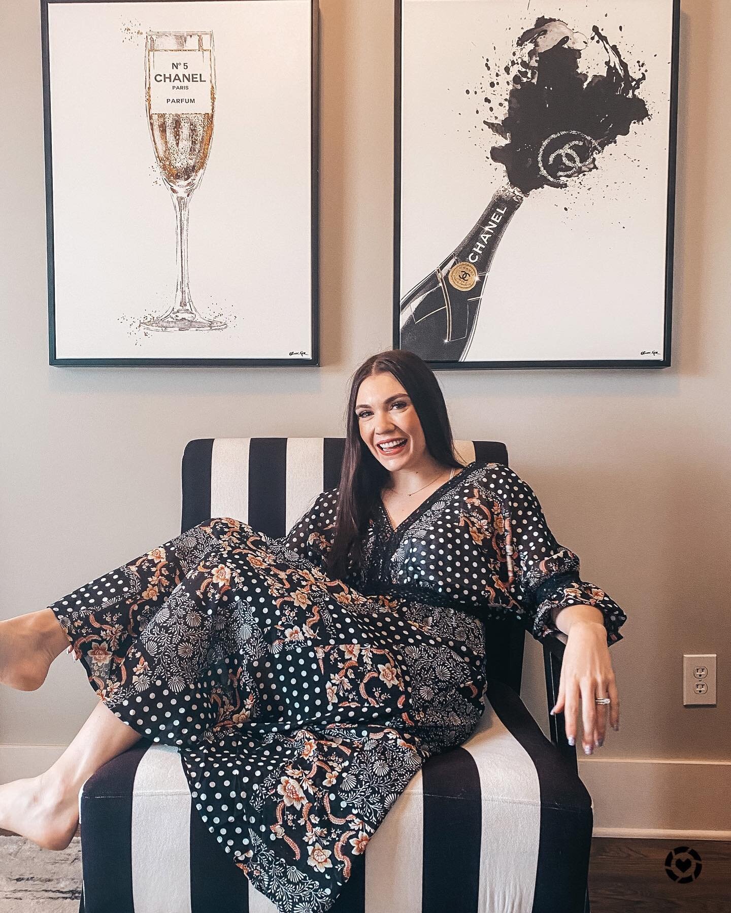 We finally finished my dressing room! We went with a black and white theme here and needed to get a bit of @olivergalart to complete the space! 🥂 This spot is my fav in our house to relax with a glass of wine and a good book! Do you have a happy pla