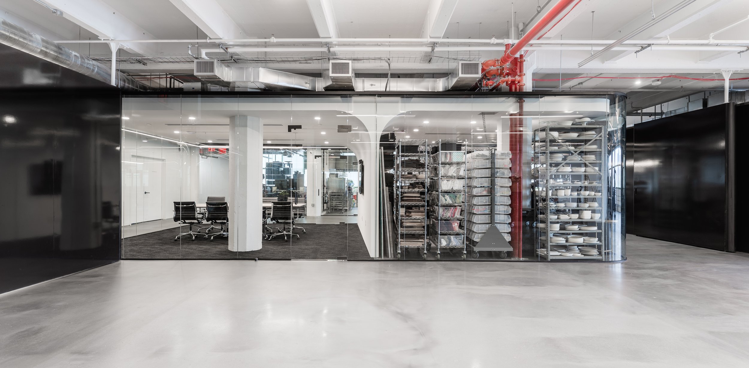  View of north conference room and prop gallery. Both custom center pivot doors are visible. In the closed position (left) and in the open position (right). 