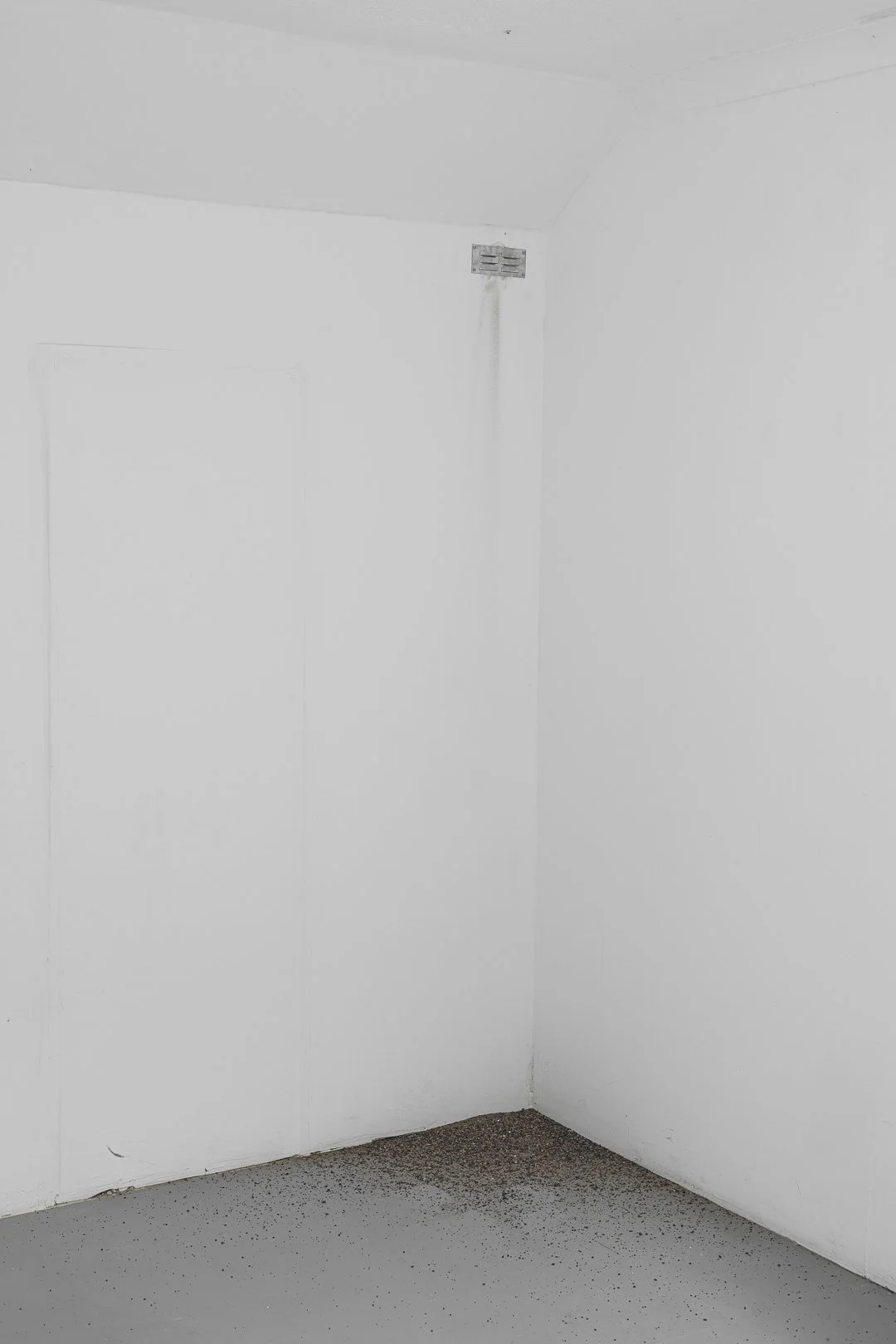 Heidi Holmström, a Spit out - a leak. Site-specific installation, indoor air channel parts, tube system, excess gravel and dust from the industrial area, dimensions variable, 2025