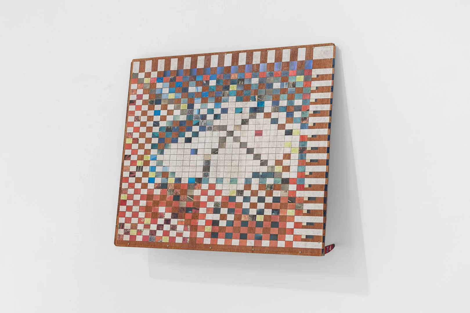 Annabel Sutton, Survey II. Collage on found board, rice paper, toy fragment, 117w x 101h x 20d cm, 2026.