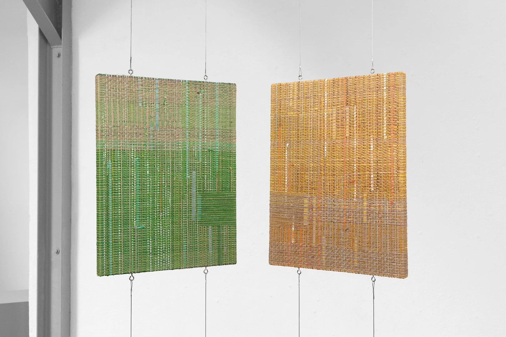 Medha Khosla, Time Horizon. Discarded jute fiber, plastic cables, deconstructed fishing rope, industrial plastic waste, plastic
bag strips, found packing material, handwoven around canvas panels, 36w x 46h cm, 2026.