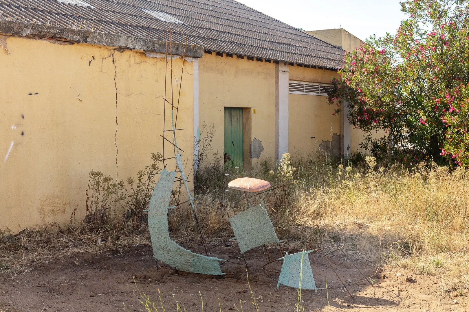 Jesse Strikwerda, Blue-Seating (rest). Metal, paper mache, industrial waste, seat, banner, 250w x 130d x 235h cm, 2026.