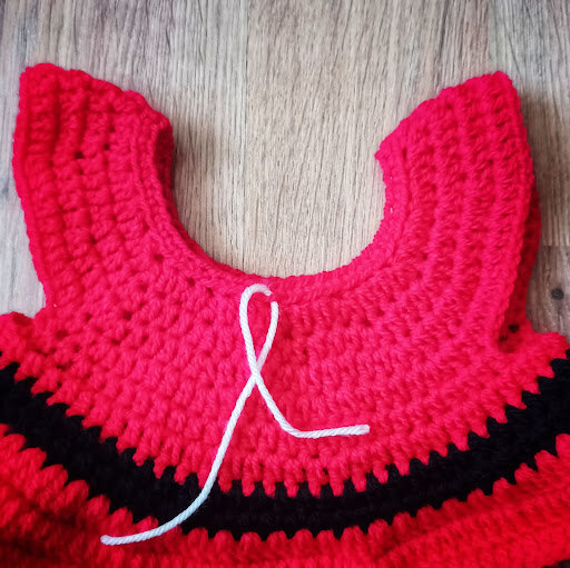 Find the center stitch in the front loops from row 2