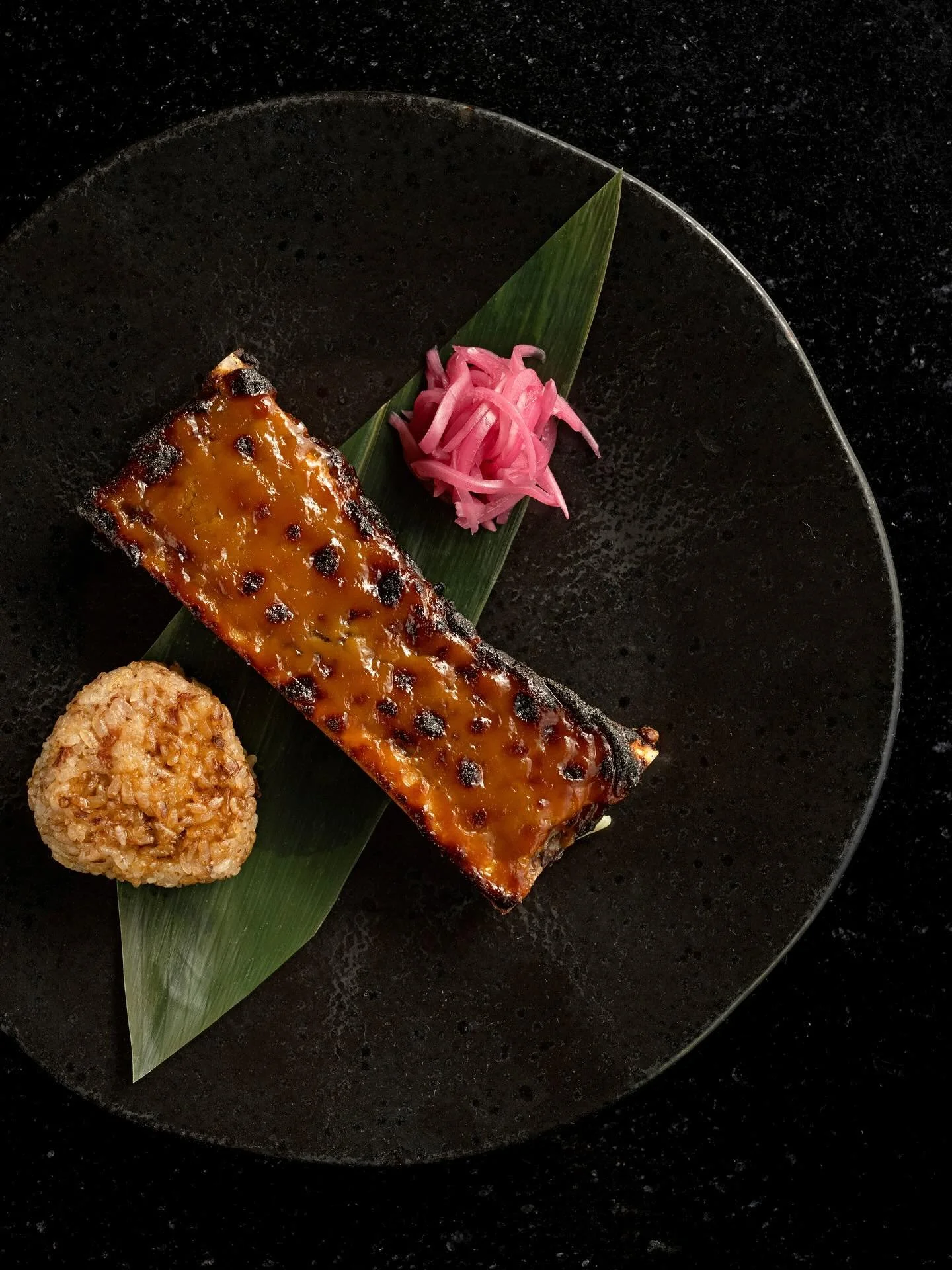 Celebrate the impending weekend by slathering our Miso Baked Bone Marrow all over the yaki onigiri, taking a big bite and washing it down with an ice cold glass of sake. Happy Friday!