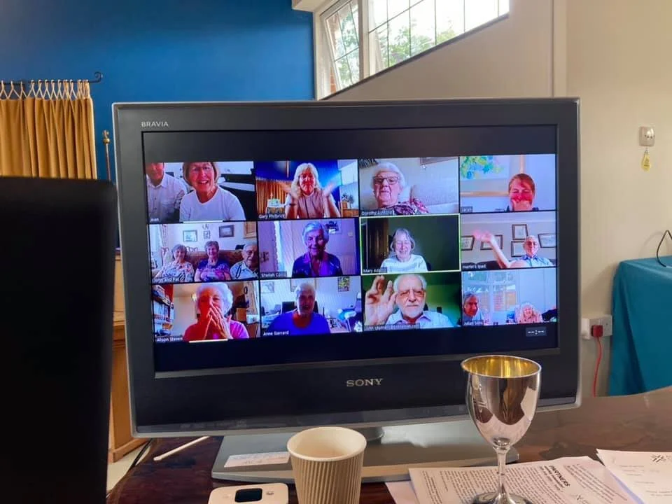 Photo showing people in a Zoom call.
