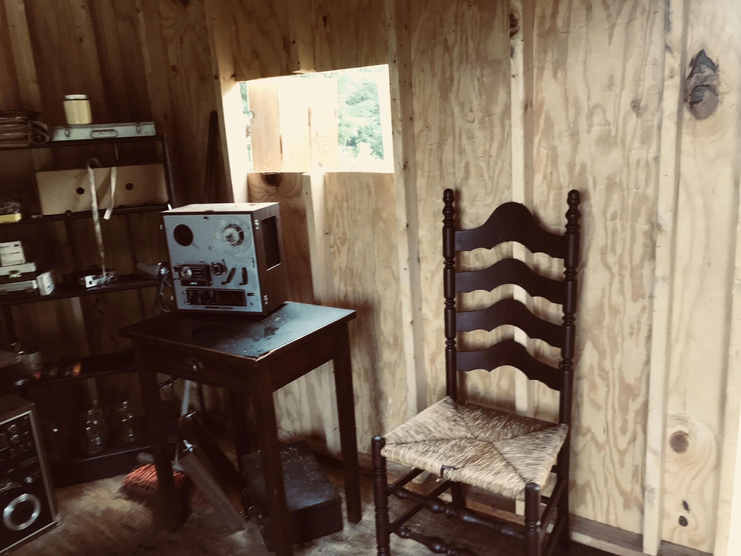 INT. Jim Jones radio room Jonestown