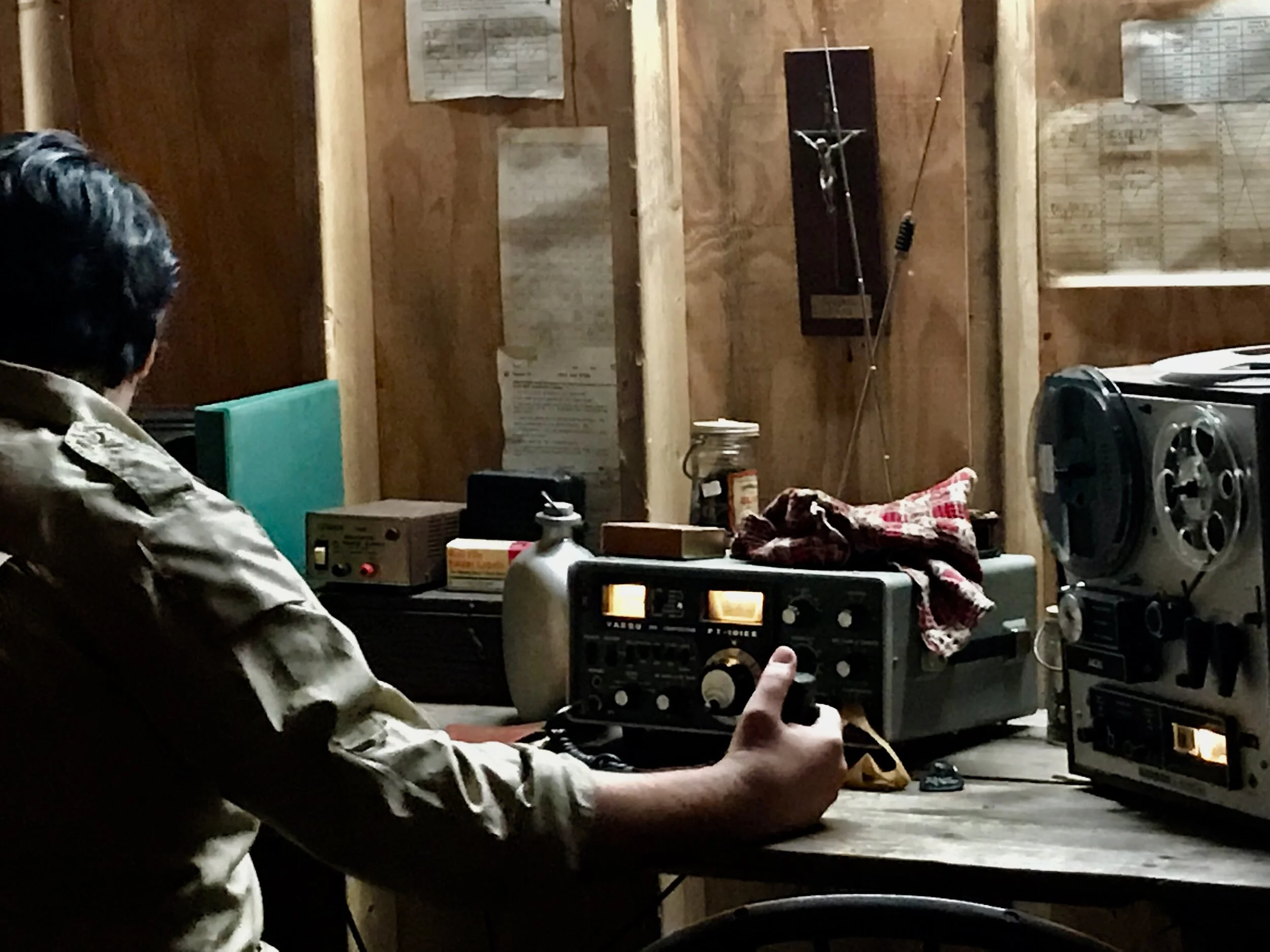 Jonestown INT. Jim Jones Radio Room 