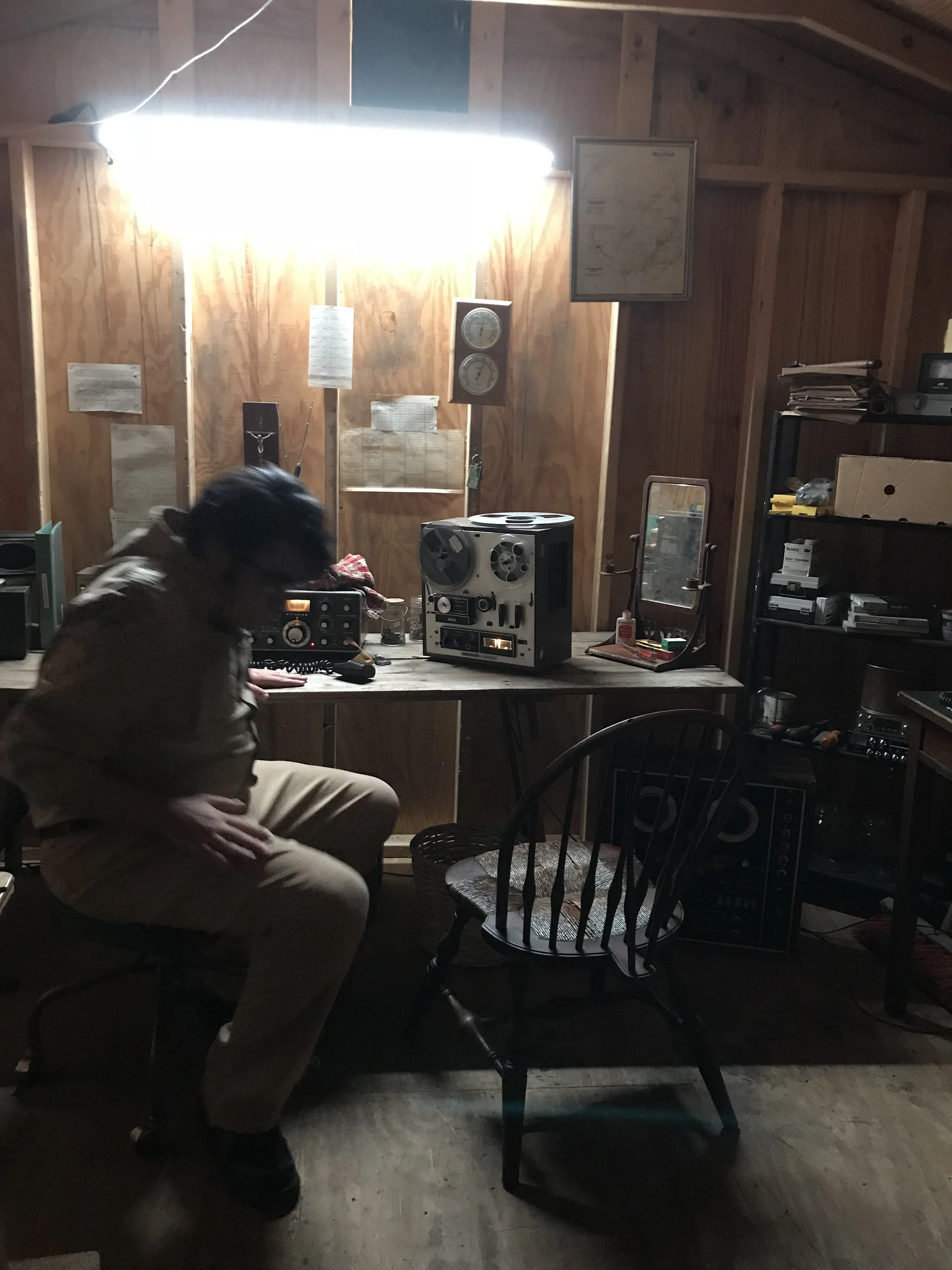 Jonestown INT. Jim Jones Radio Room 