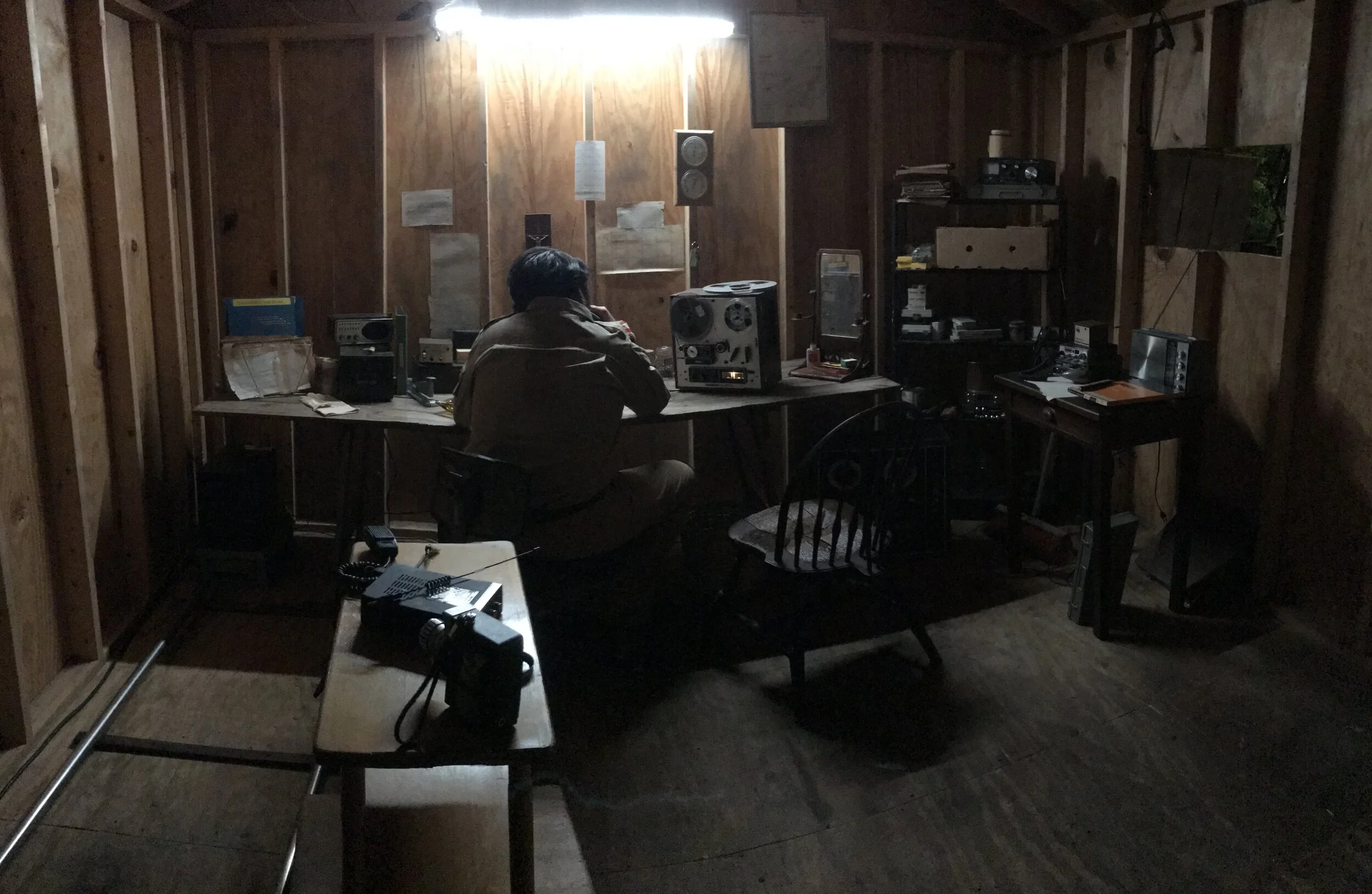 Jonestown INT. Jim Jones Radio Room 