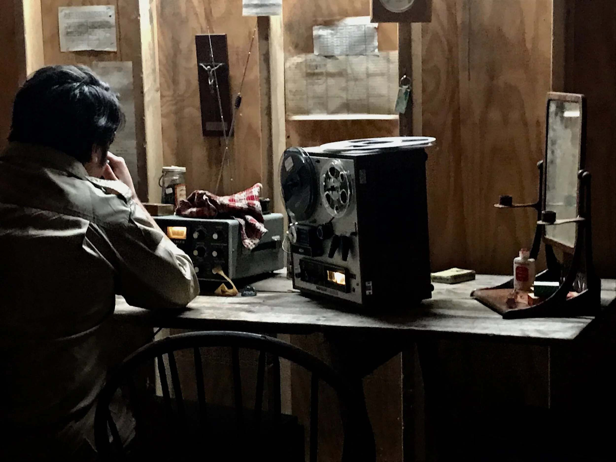 Jonestown INT. Jim Jones Radio Room 