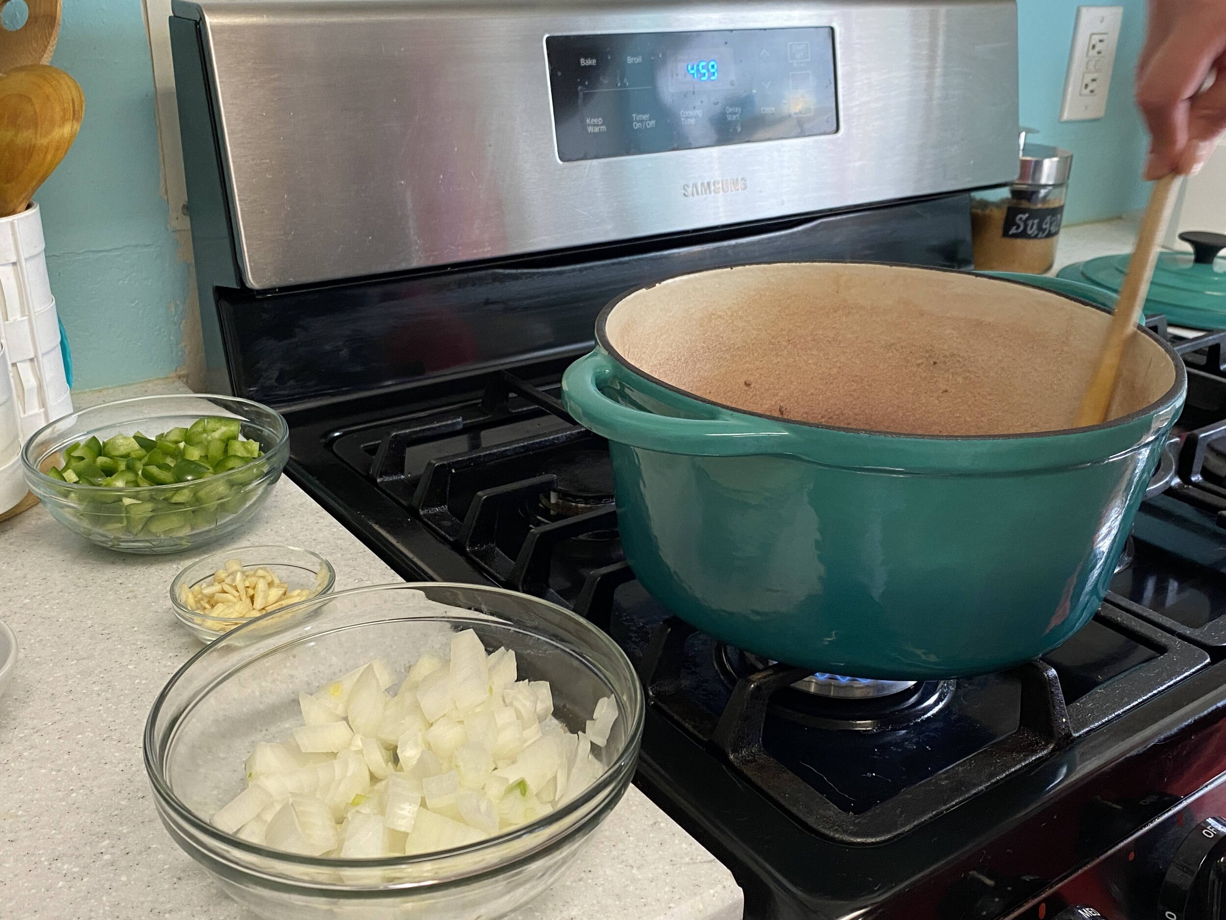 Once i have the meat going, I like to keep the onion, garlic, and peppers close by so that they can be added quickly. This dish really moves quickly, and I have definitely been caught on the hop by not having all the ingredients prepped before hand.