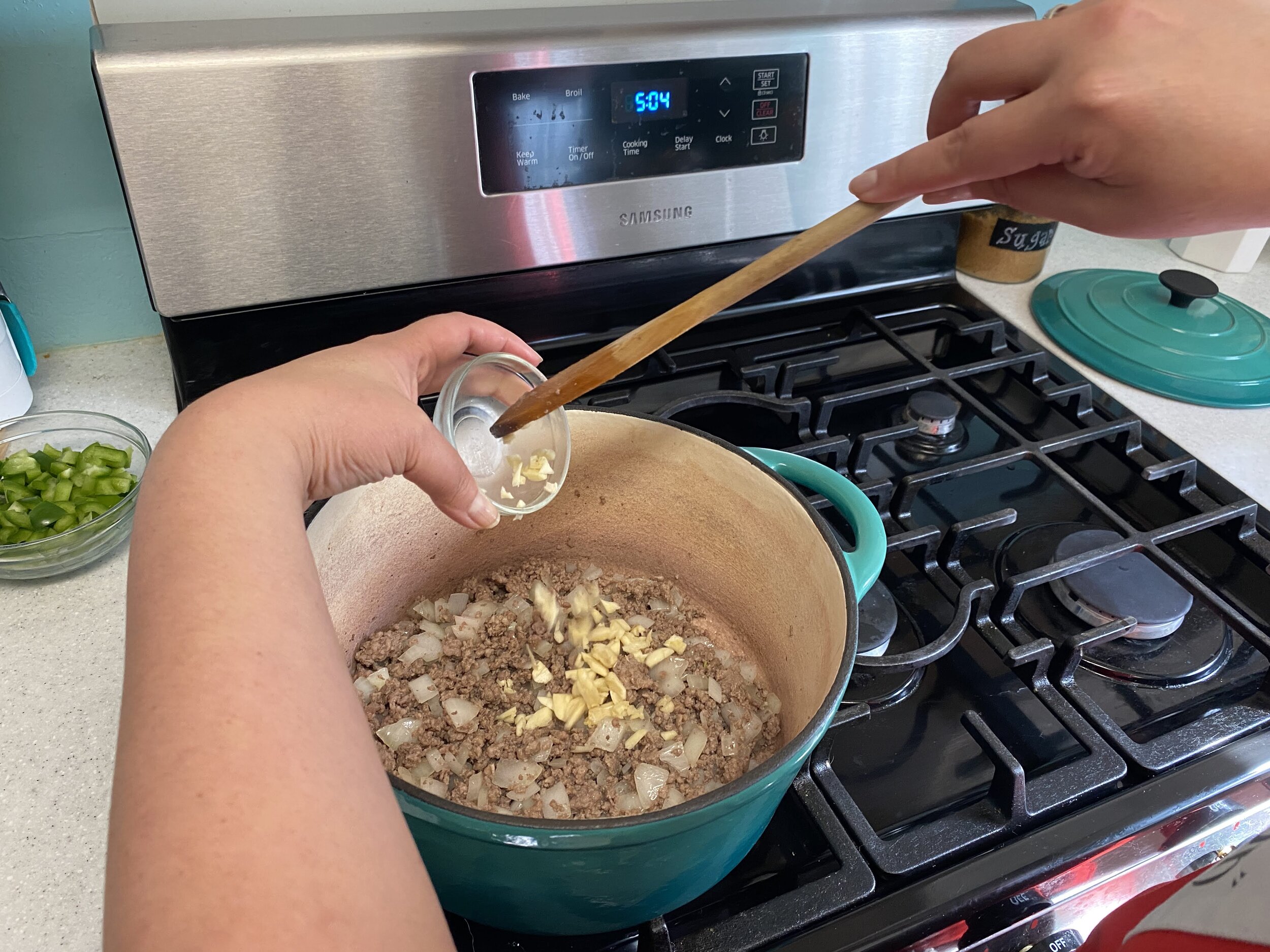 Add the garlic and stir it constantly until you just begin to smell the garlic.