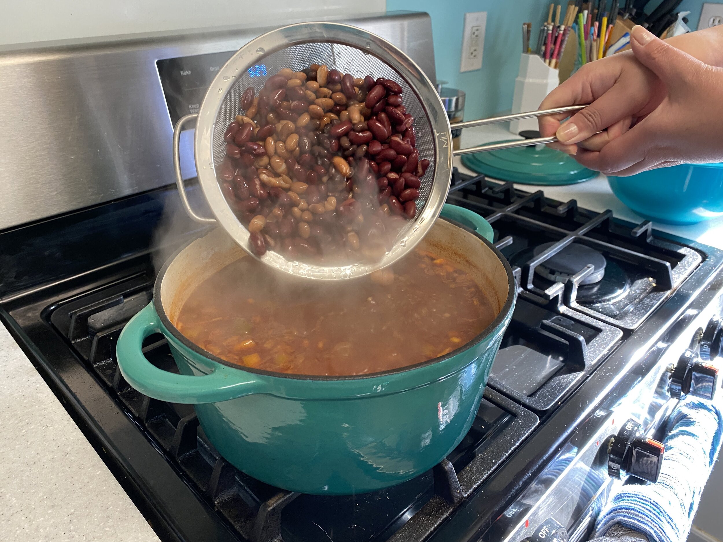 Add the beans, and bring back to a boil. The chili ready to eat as soon as as the beans are heated through, but feel free to simmer for longer. It’s even better the next day.