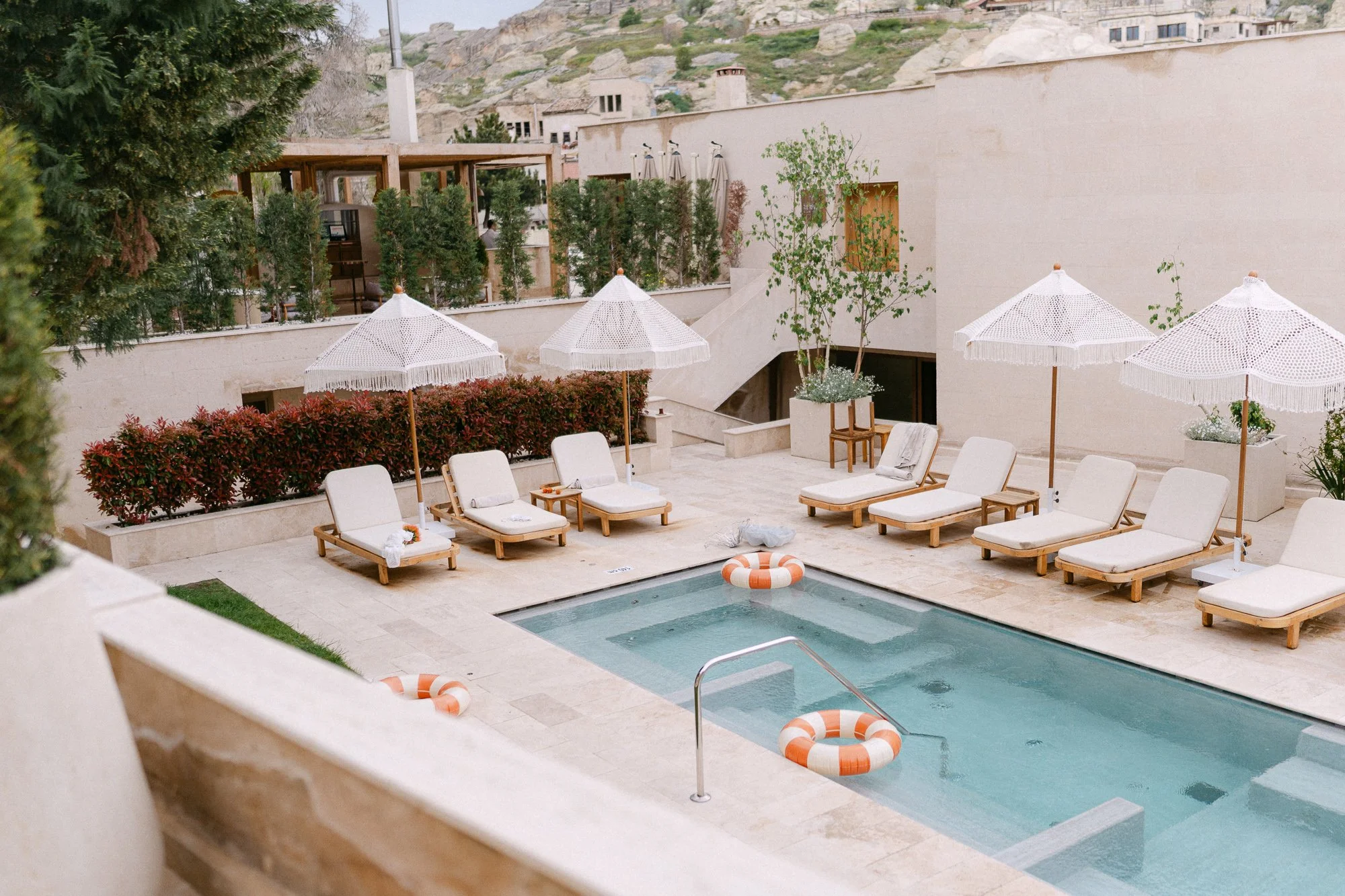 Aerial view of hotel pool area with sun loungers — Cappadocia wedding venue