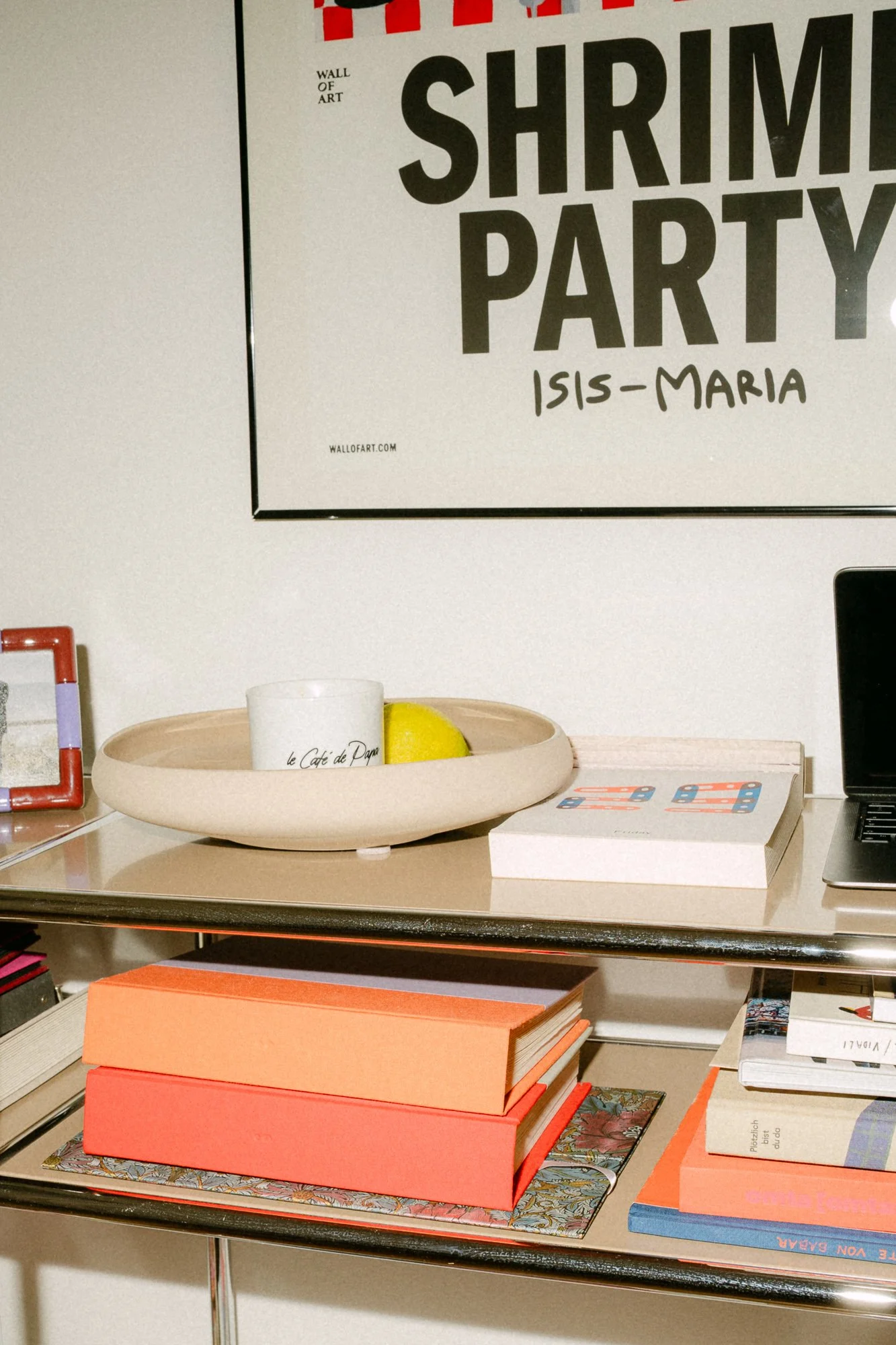 Living room interior with Shrimi Party poster and colourful objects — At Home with Antonia editorial