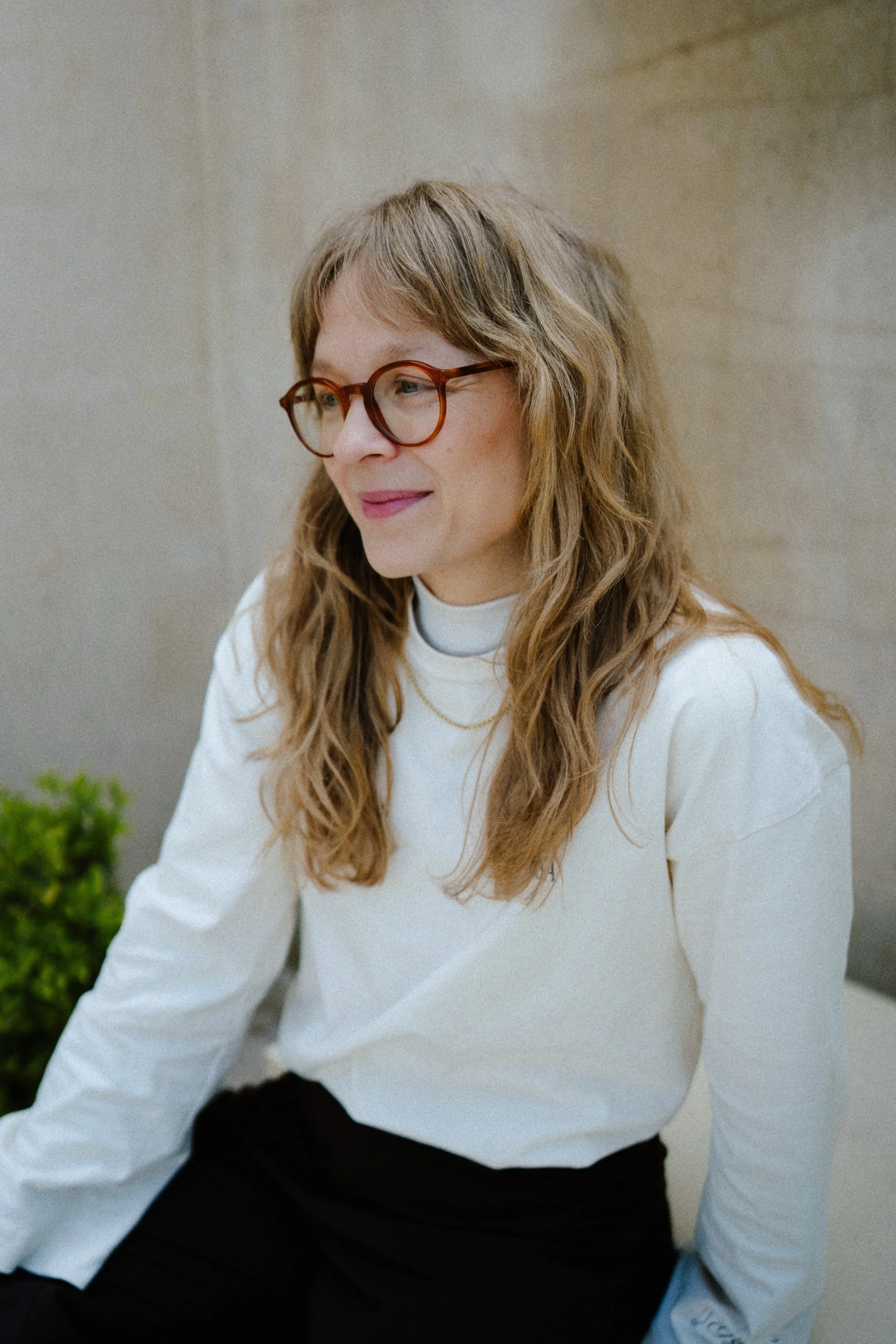 Portrait of photographer Katharina Gless in white sweater — Leipzig based photographer