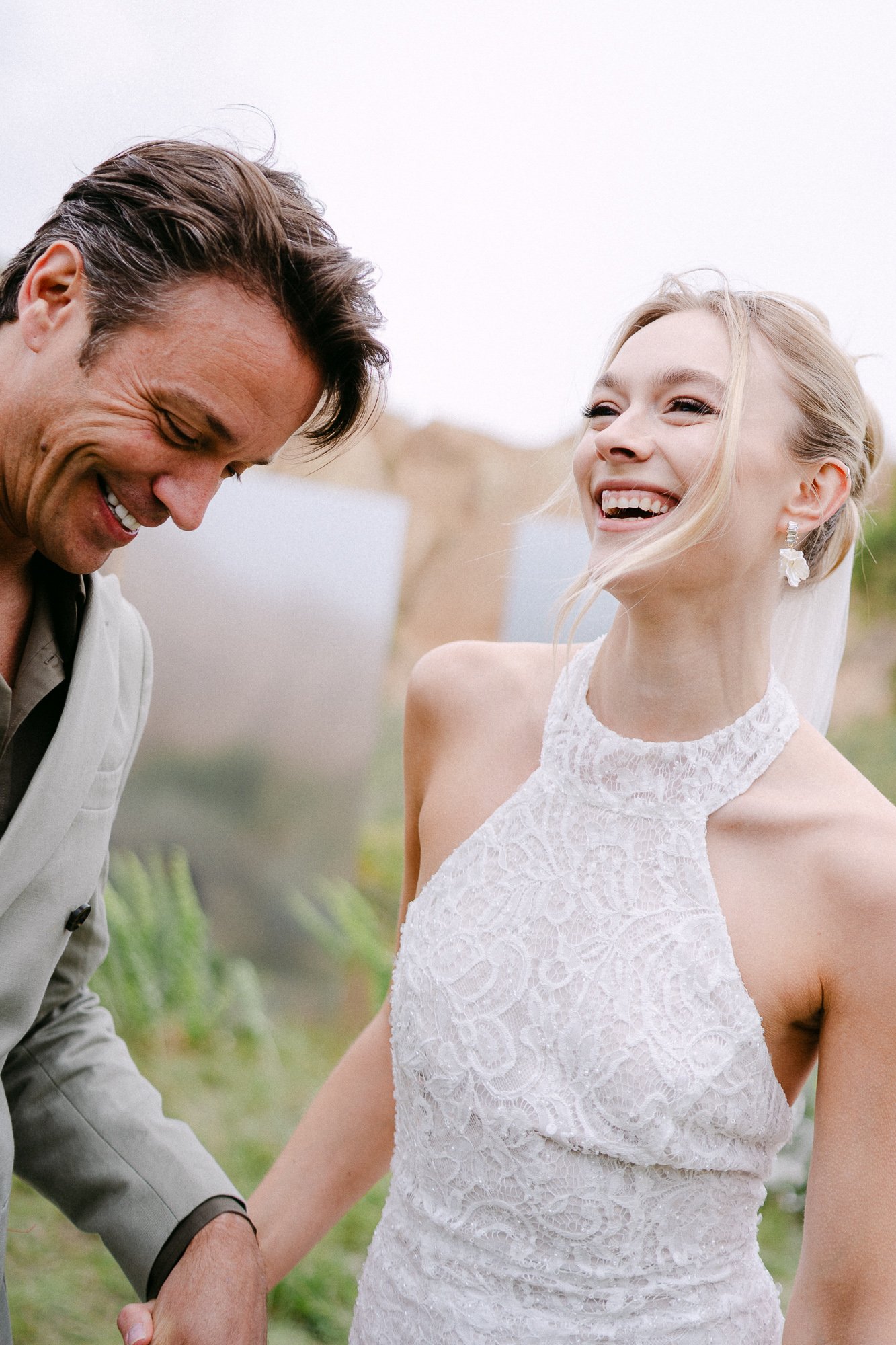 Bride and groom sharing a joyful moment in Cappadocia — emotional wedding photography