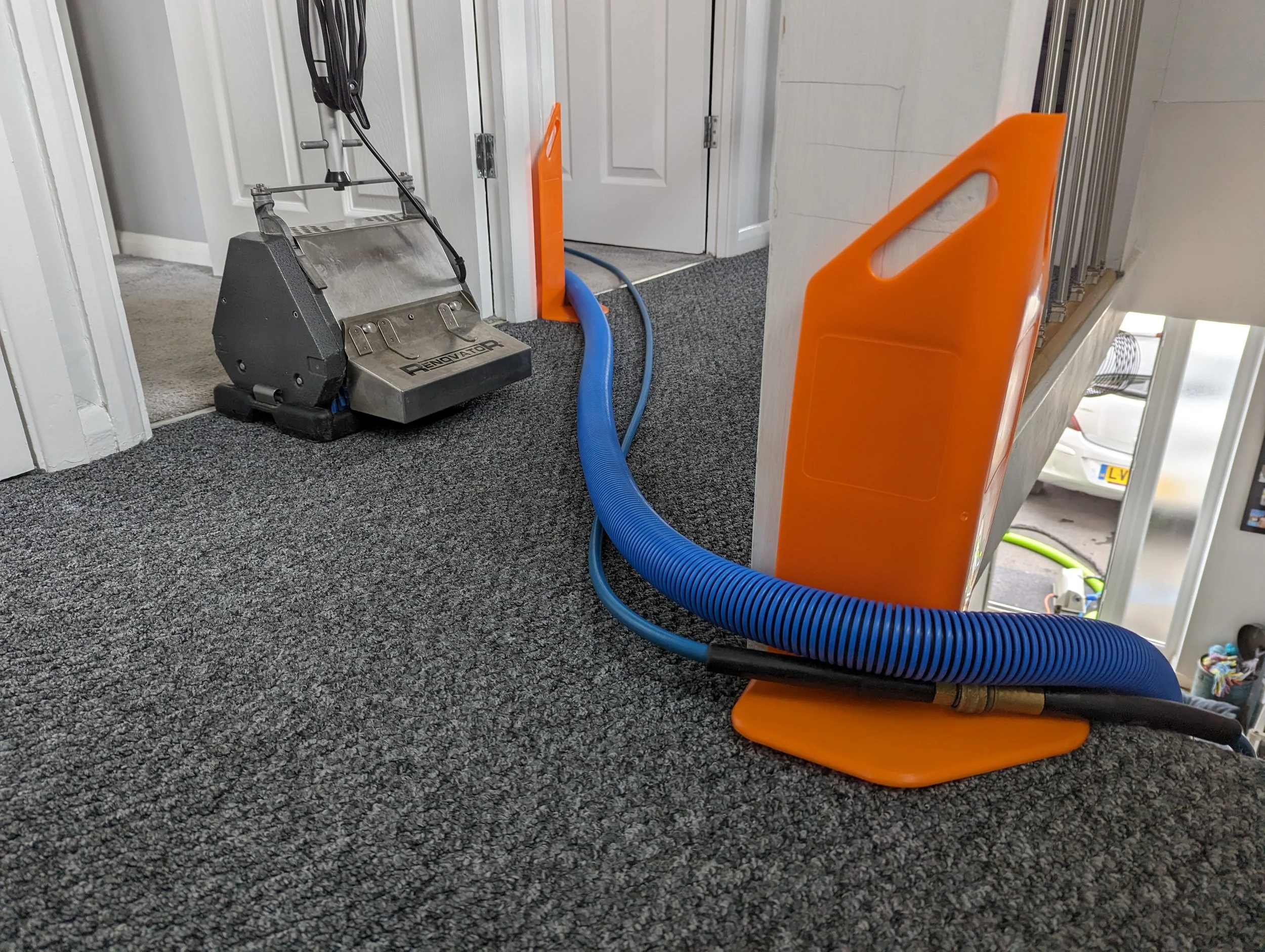 Corner guards in use to prevent hoses rubbing on paintwork during the clean.