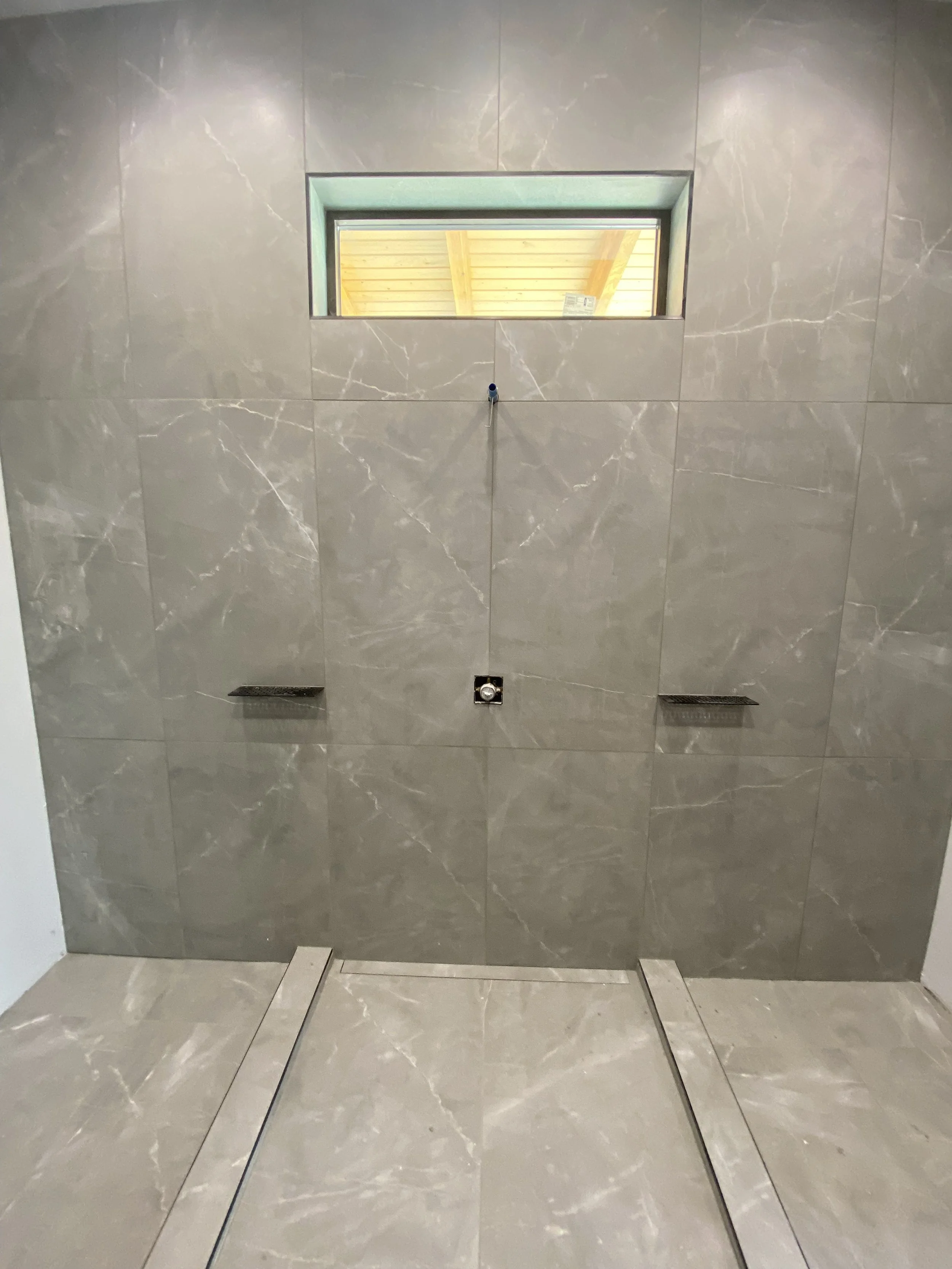 Custom bathroom shower under construction during the home building process in Driggs Idaho