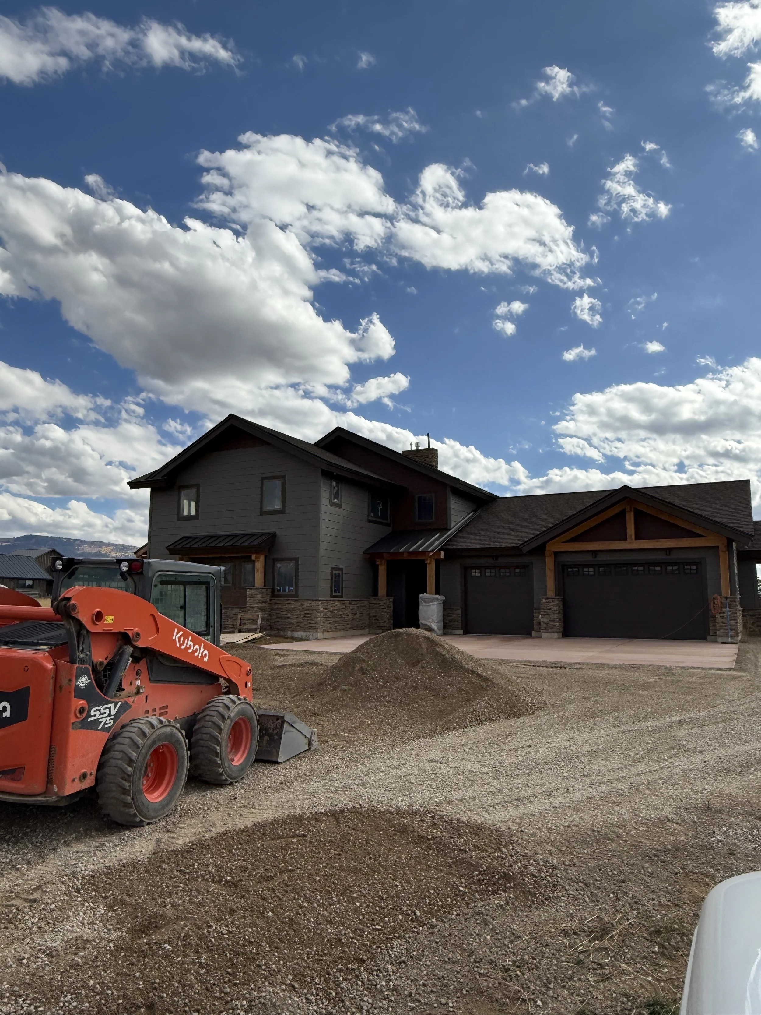 Custom home under construction in Eastern Idaho with modern exterior design and mountain views.