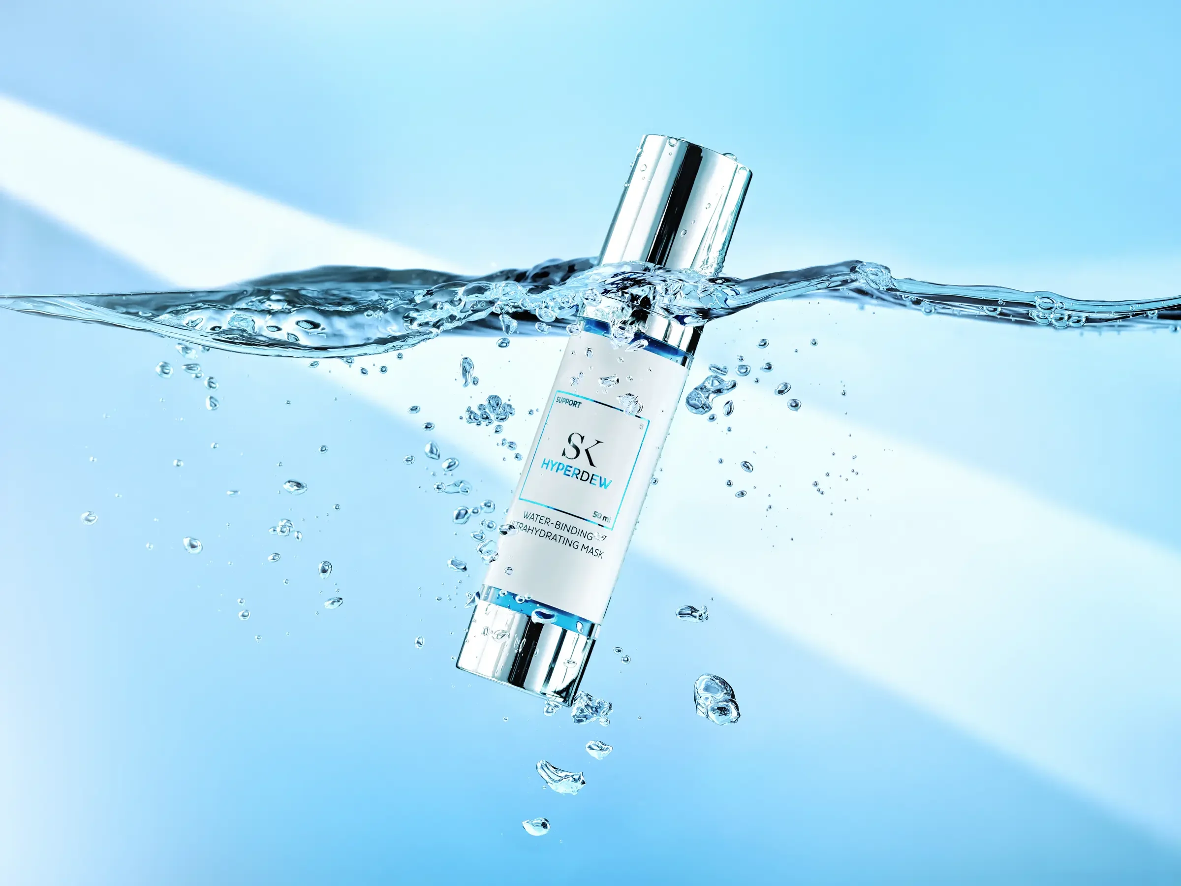 A skincare product labeled 'Hyper Dew' water-binding and hydrating mask floating in water with bubbles and splash.