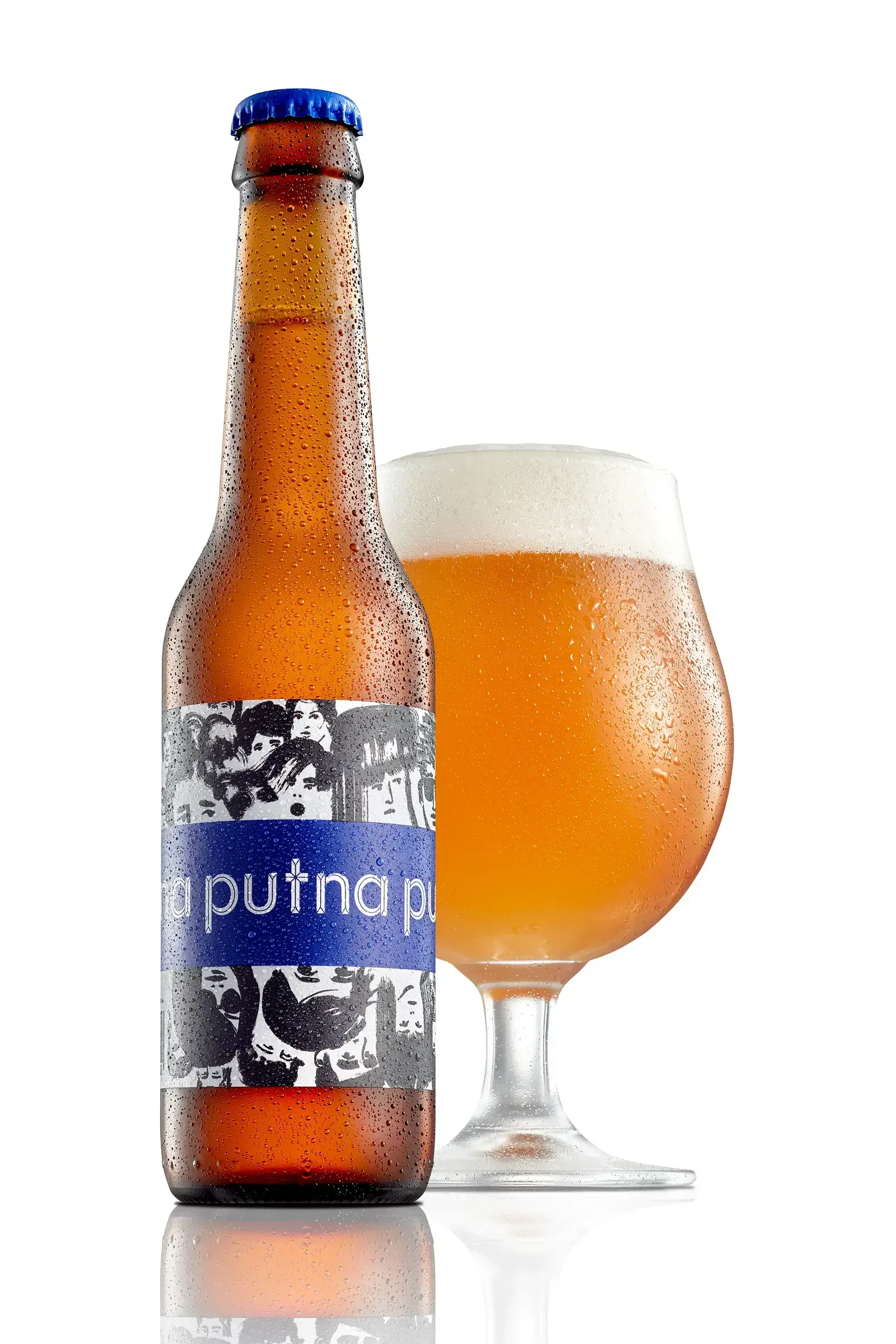 A bottled beer with a blue cap and a colorful label, placed next to a glass of beer with a foamy head, against a white background.
