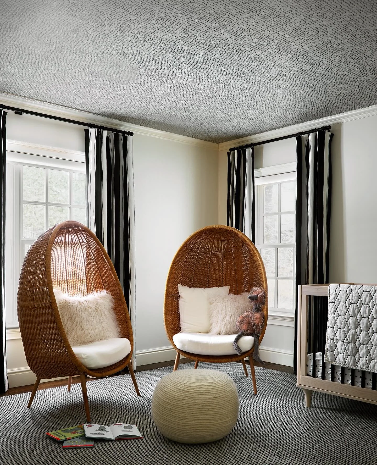In a busy family home, everyone needs their own retreat. These cocoon chairs in this Weston nursery offer exactly that - a place for quiet reading, late-night feedings, or just a moment to breathe.

The textured ceiling adds subtle visual interest wi