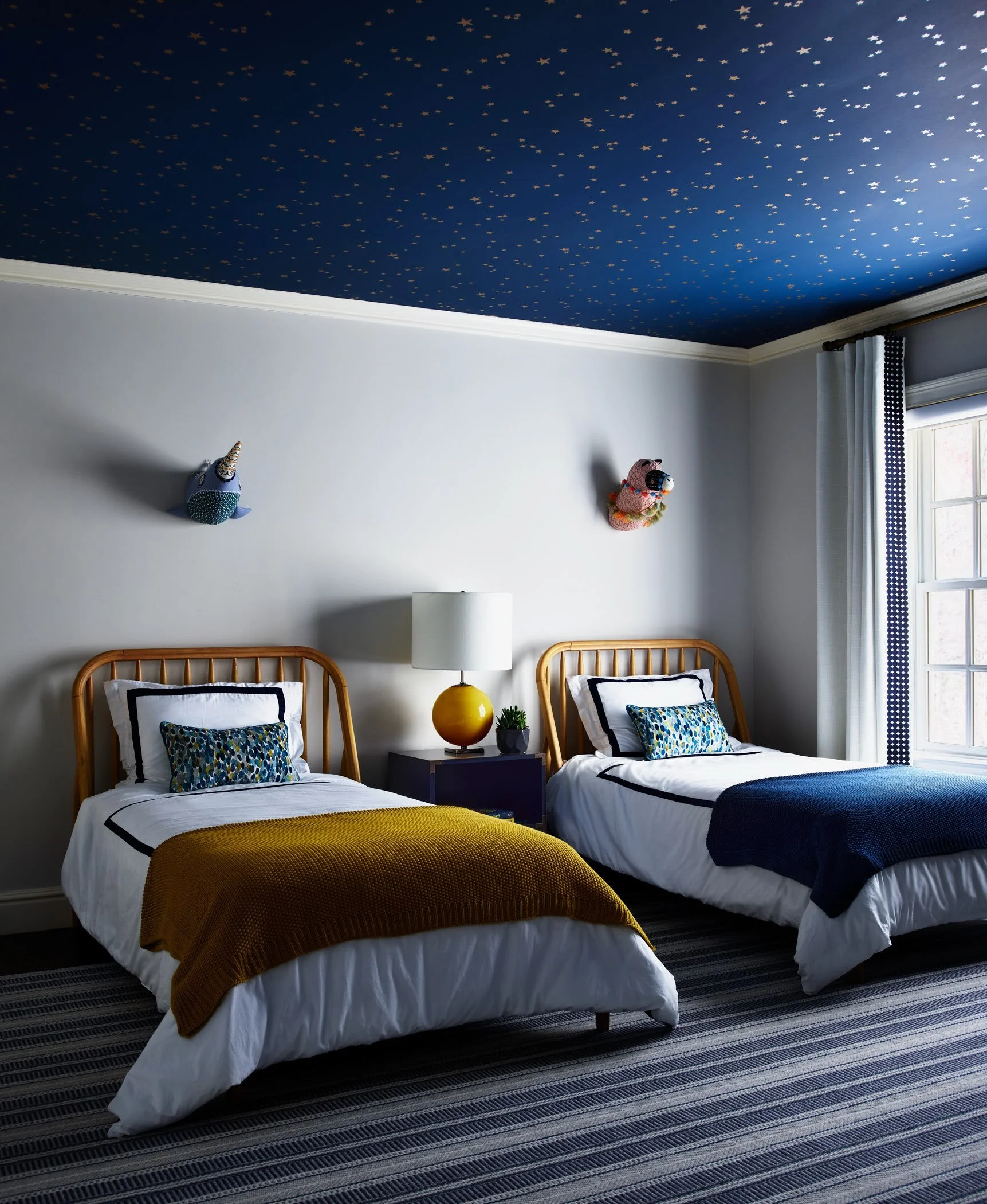 Blue is never just one color in our work. It&rsquo;s a ceiling in Weston that makes a kids&rsquo; room feel like it&rsquo;s holding the sky. It&rsquo;s the quiet confidence of a Harwichport bedroom done in various blue tones. It&rsquo;s a Wellesley b