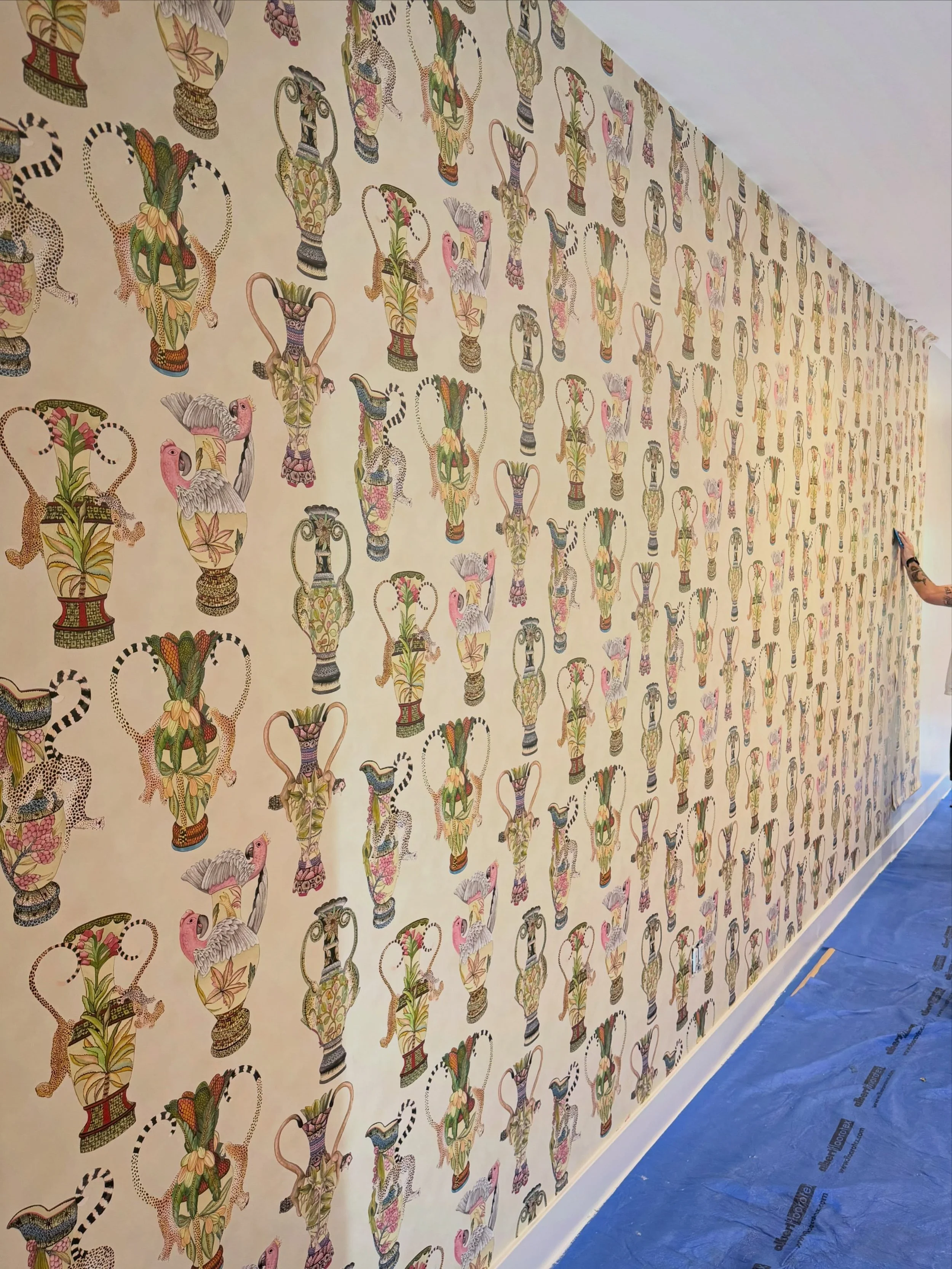 Some rooms ask for restraint. This client asked for more, and I&rsquo;d rather commit fully than split the difference.

A jungle scene wraps the powder room floor to ceiling, no breaks, no relief. Down the hall, a vase pattern constructed of animals 
