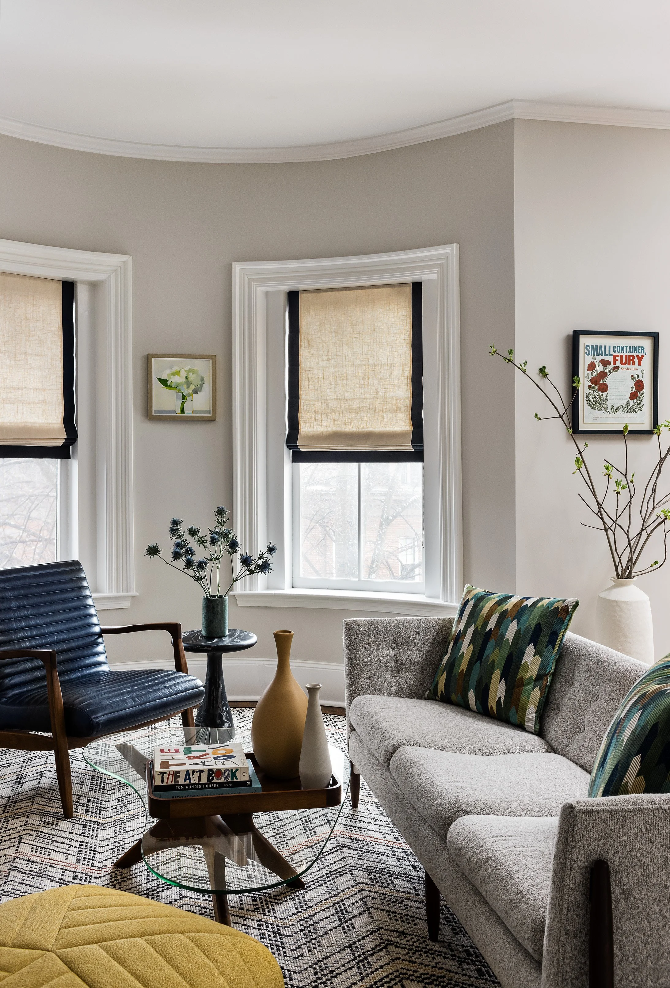Mid-Century Modern Home with tufted sofa and channeled leather chair.