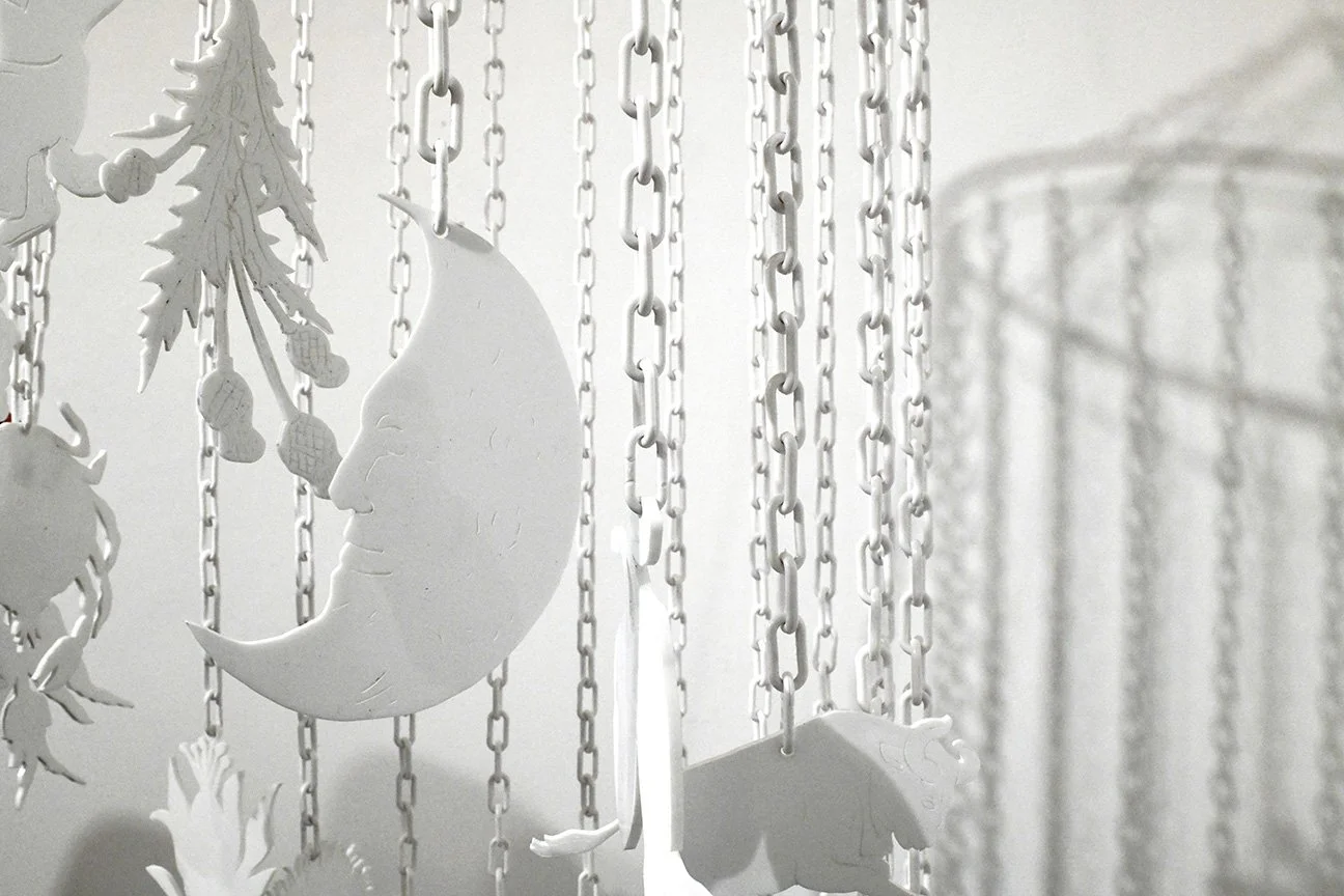 Fruits of Heaven and Earth, aluminum ring, plastic chain, laser etched and cut white acrylic, 24” x 24” x 84”, 2025 (detail)