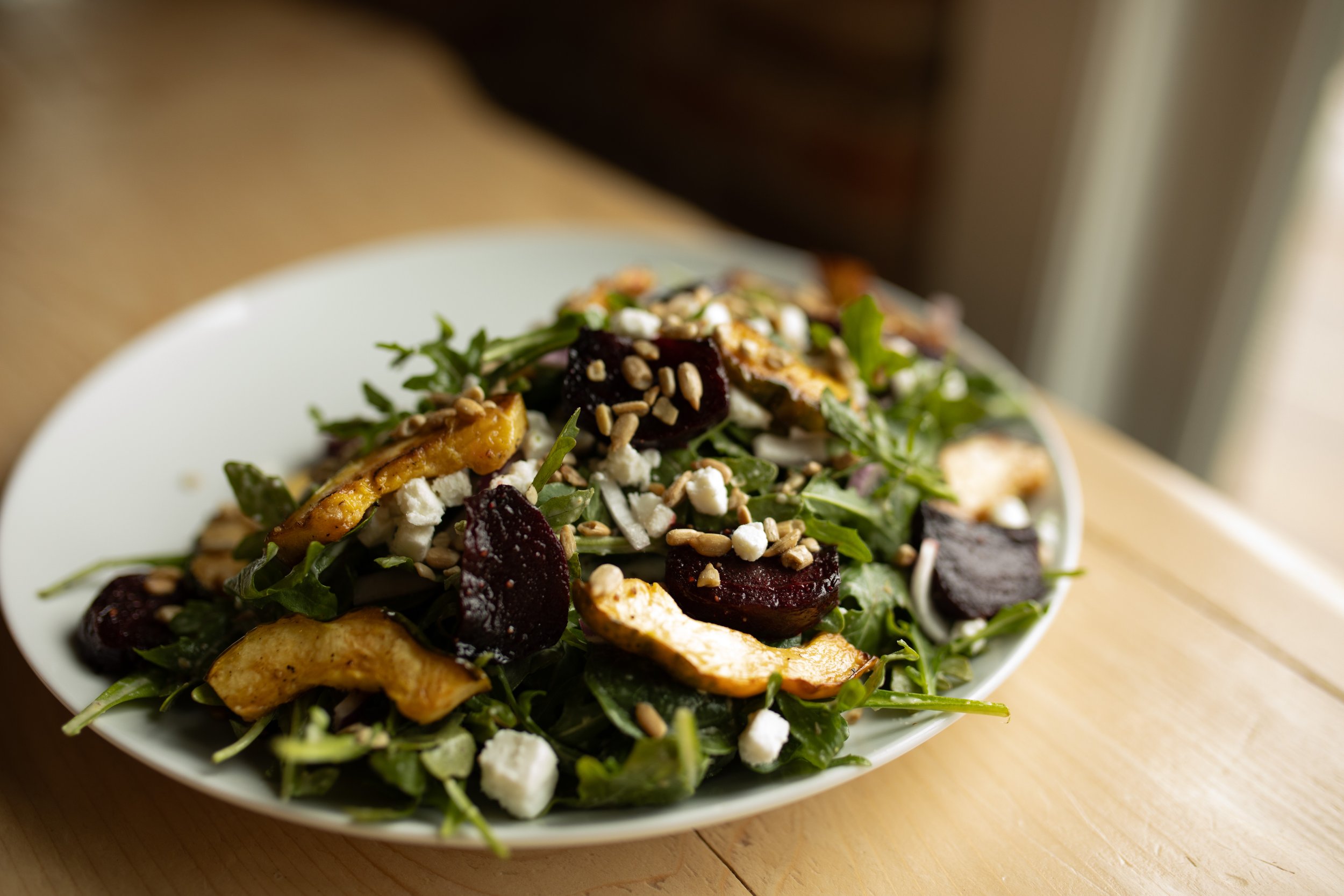 Roasted beet & squash, chèvre, red onion, arugula, spinach salad with toasted sunflower seeds & rosemary apple vinaigrette