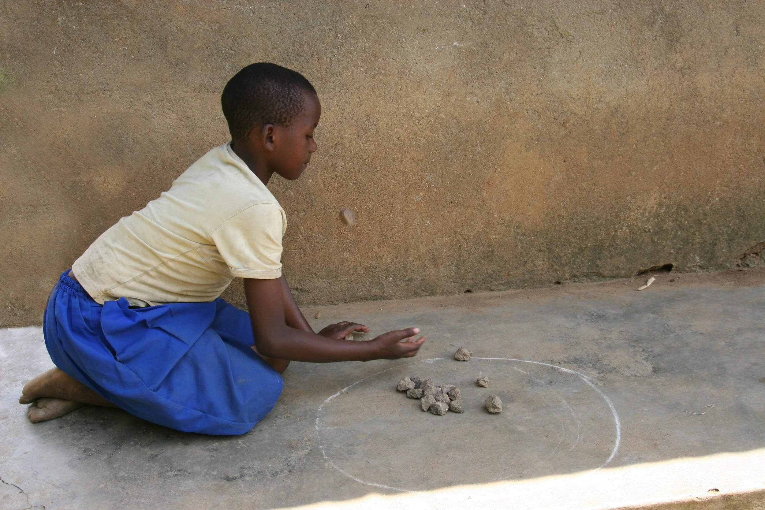 GIRL PLAYING JACKS, Muramba