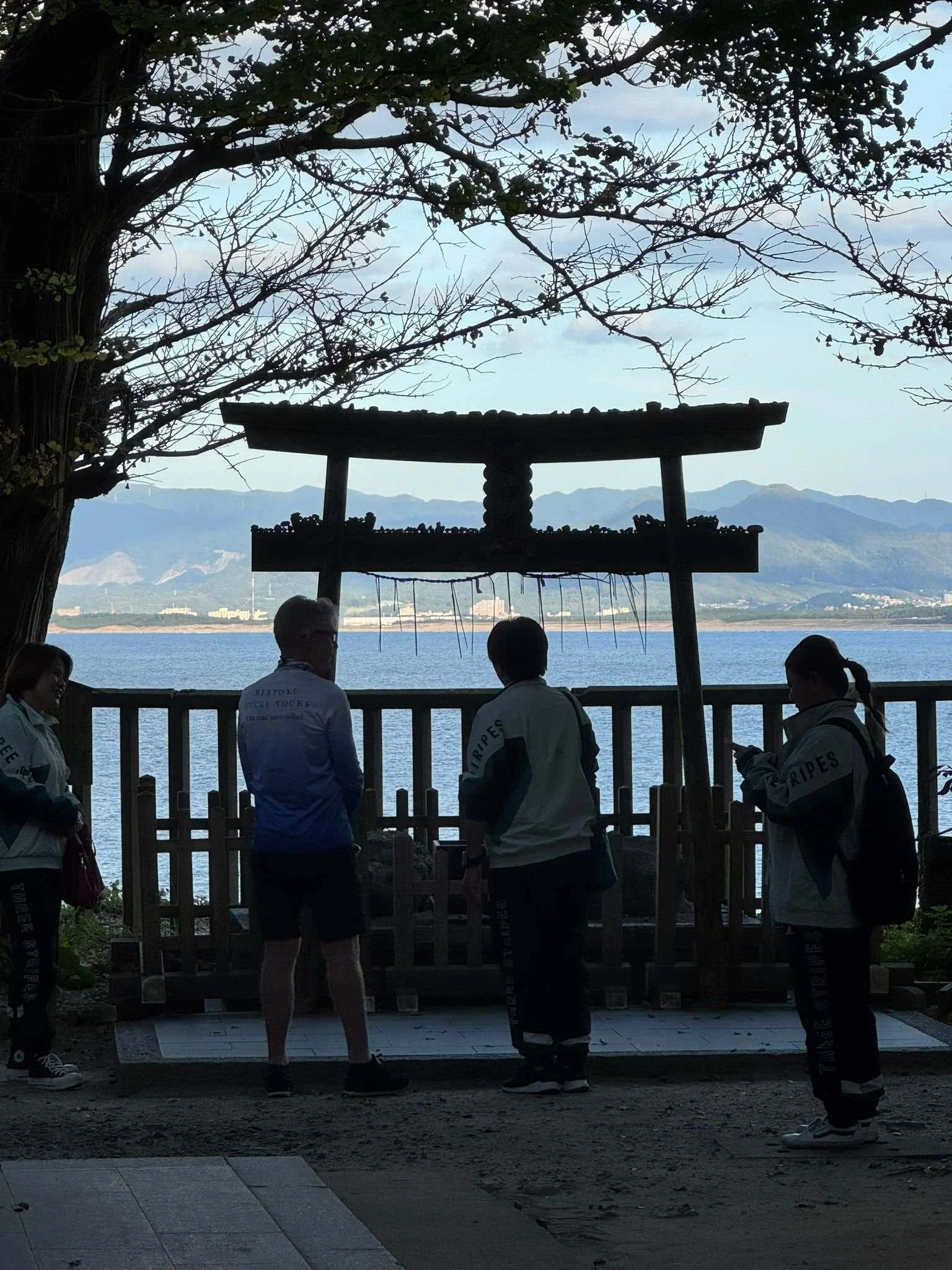 cyclists looking at a seaside sculpture on Kyushu island