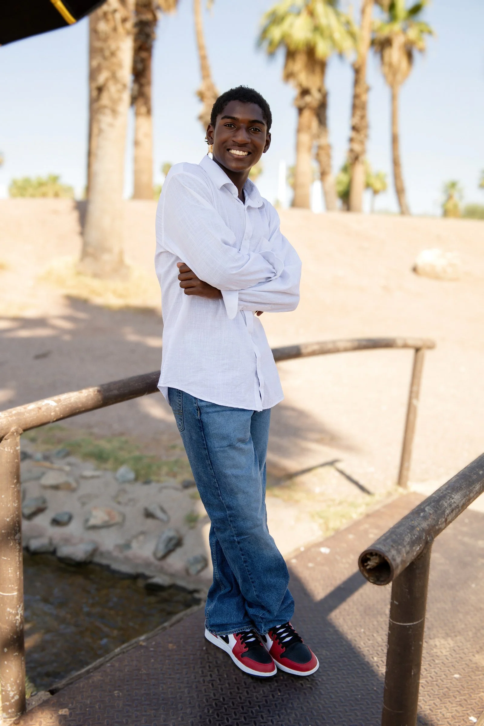Phoenix senior pictures - Kai white shirt on the footbridge