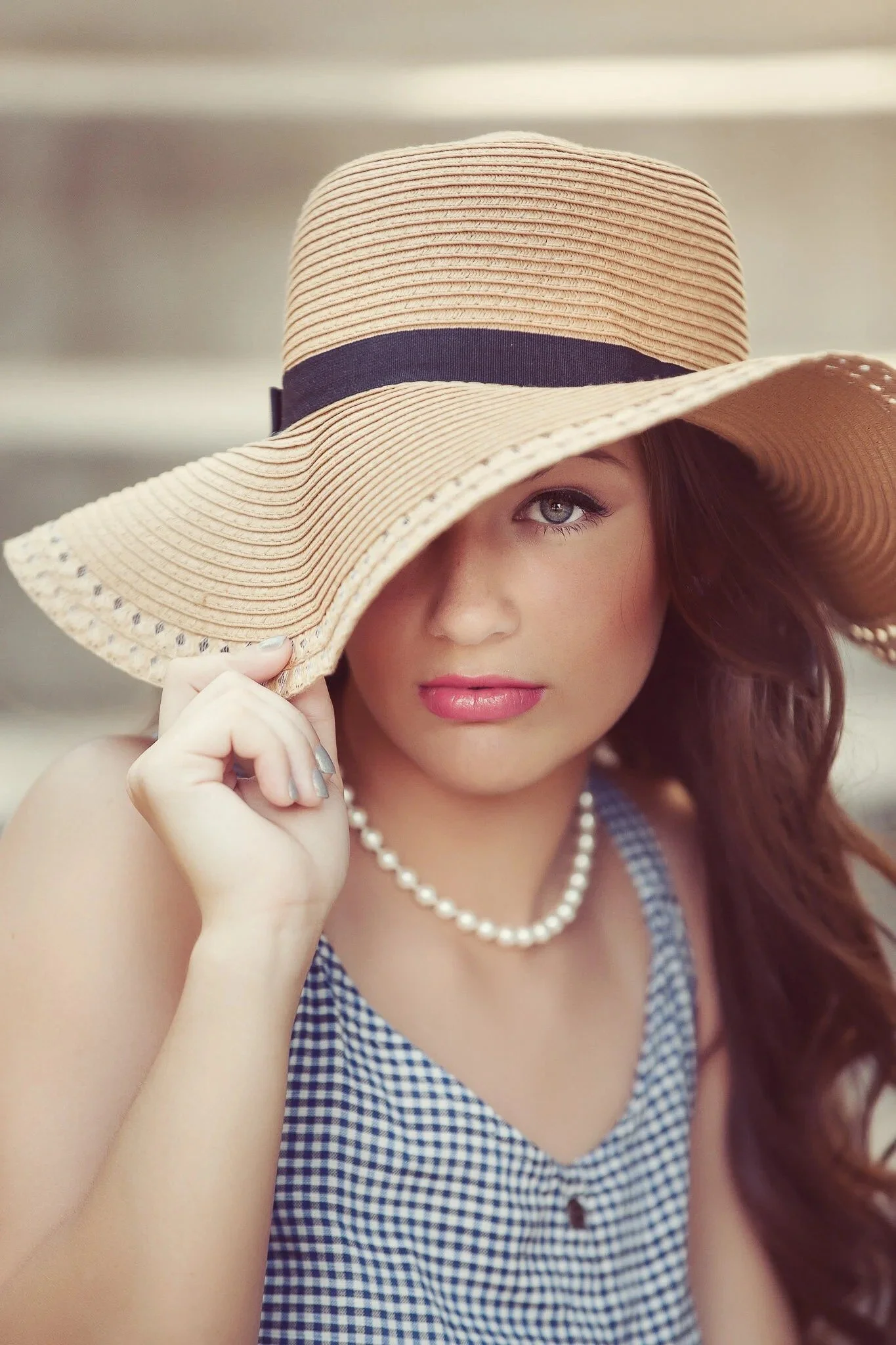 Phoenix senior photos: girl in a straw hat with a black ribbon and pearl necklace