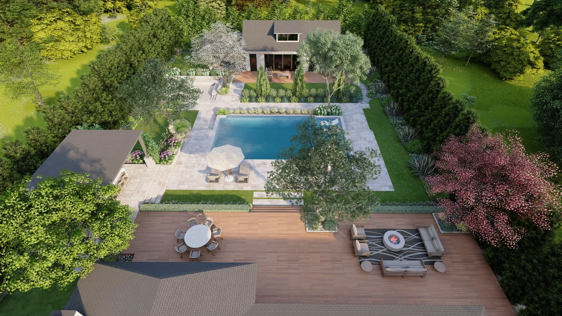 Aerial view of a backyard with a swimming pool, outdoor furniture, a wooden deck, a grassy lawn, trees, shrubs, and a house in the background.
