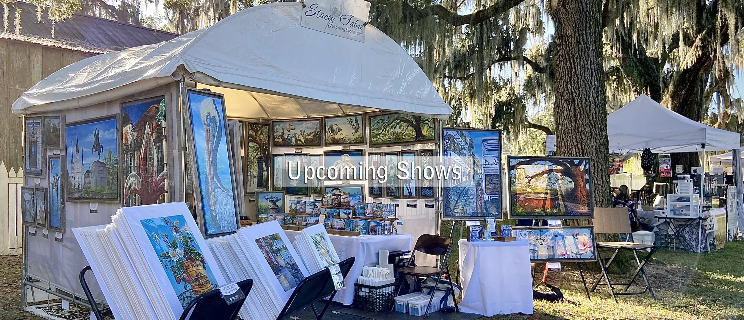 Stacey Fabre art booth setup at an outdoor event.