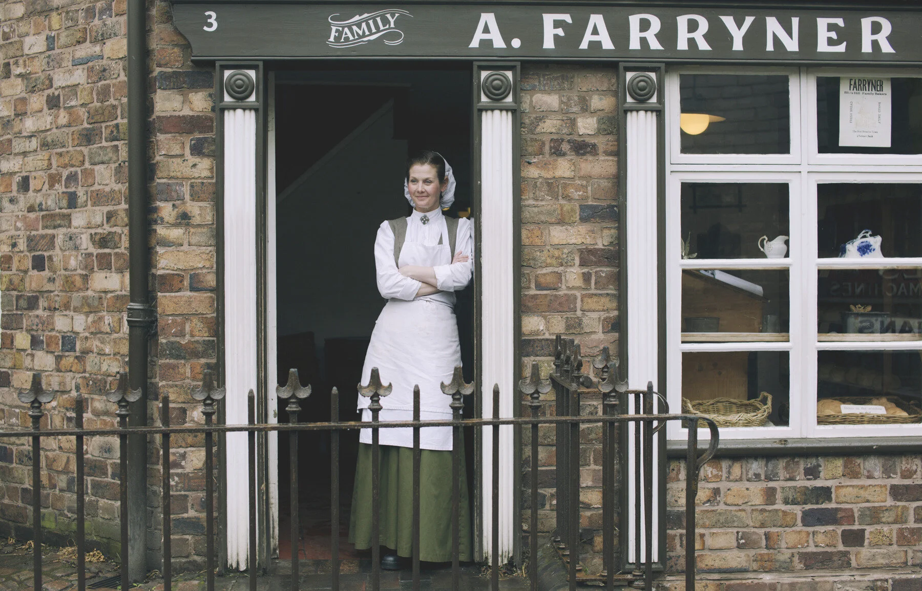 Actor Jo Halstead playing the Bakers Assistant in the Victorian Town Museum 'Blists Hill'.