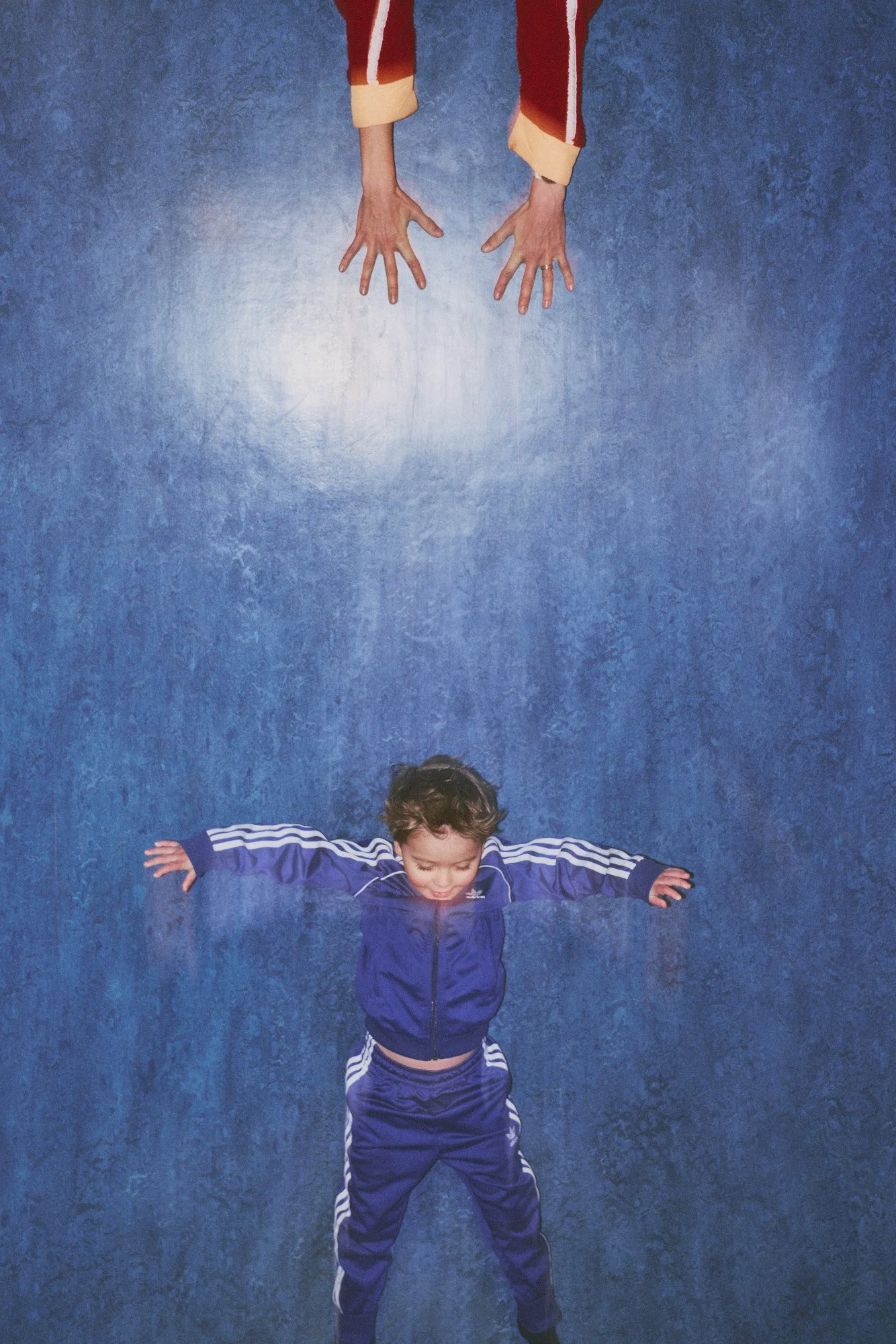 Toddler sliding down a death slide