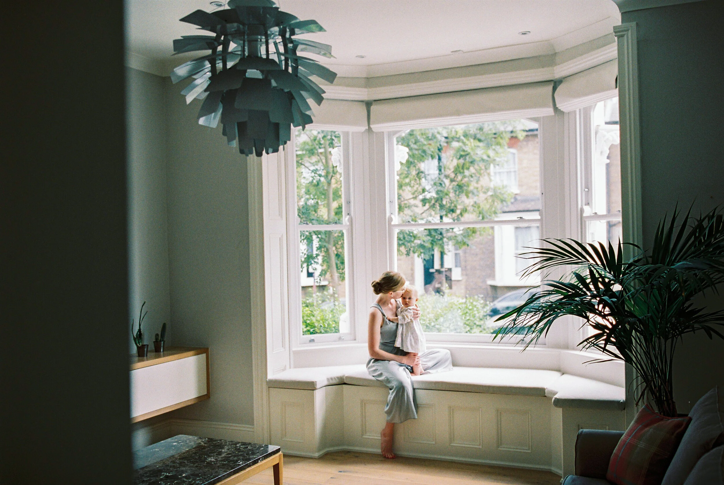 A mother and her baby in a beautiful home in Hampstead, London taken during a family photoshoot at home