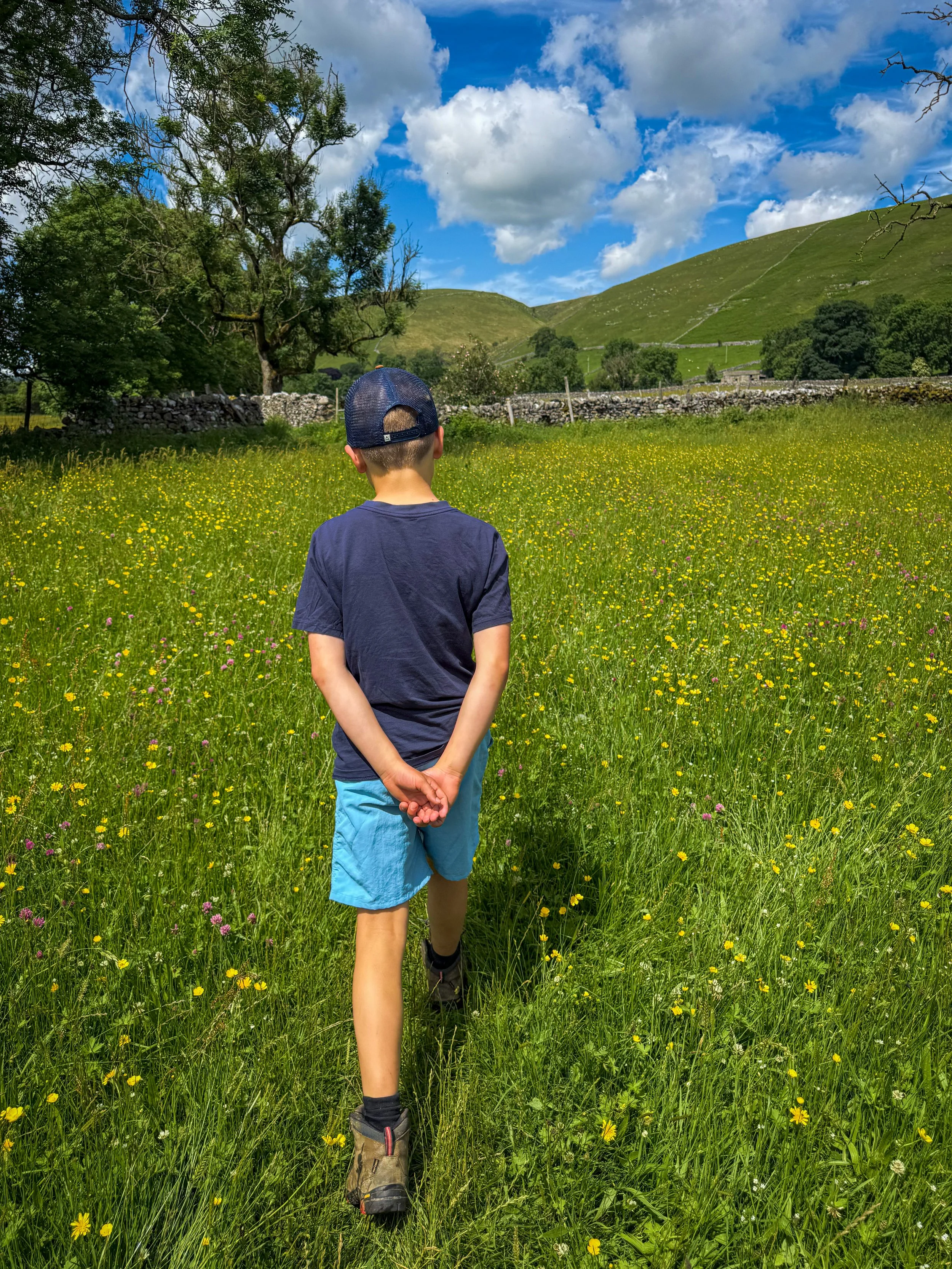 Child walking through Wildflowers