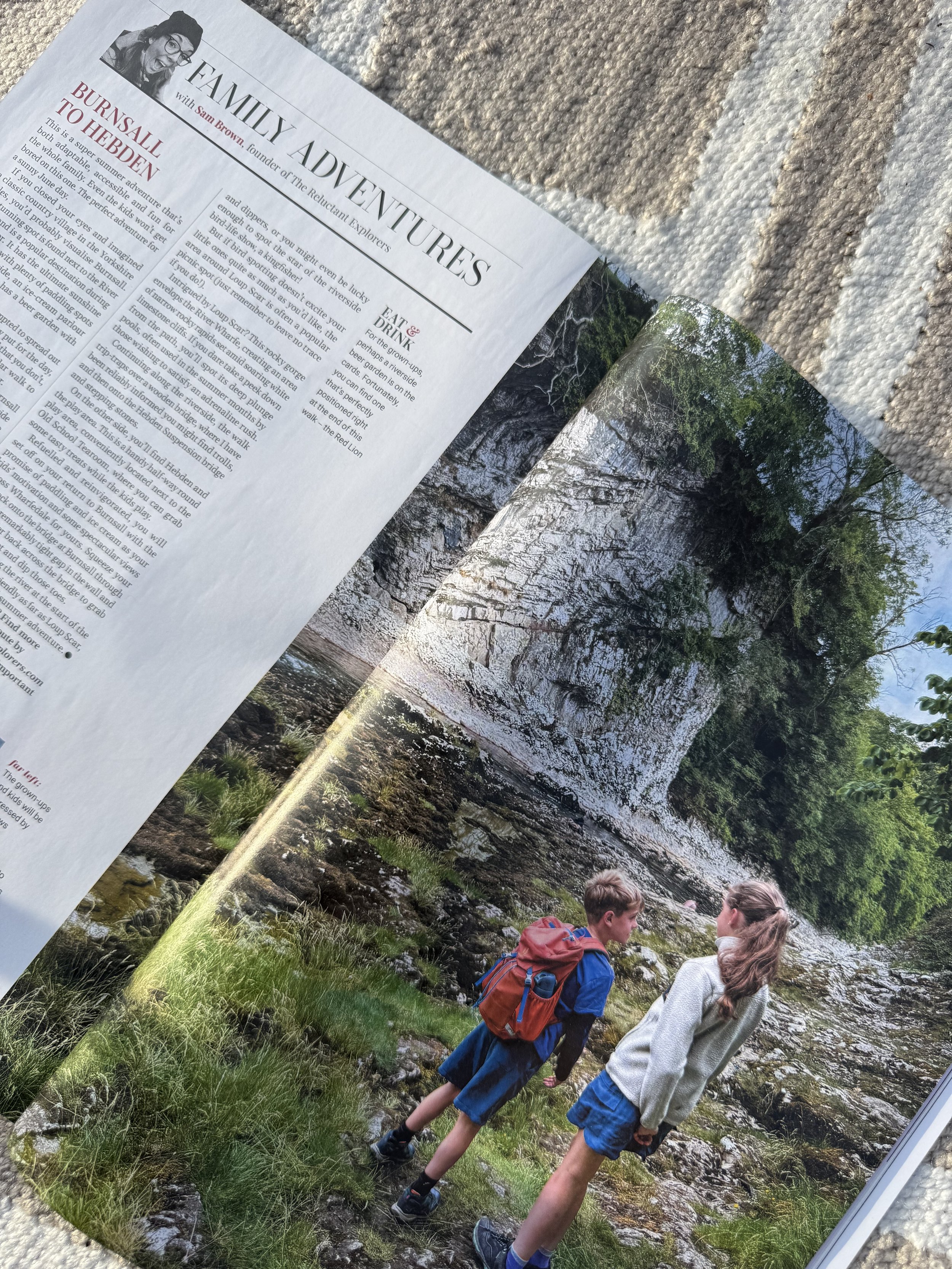 The middle of Yorkshire Life magazine feature the words of an article and a picture of two children on a walk