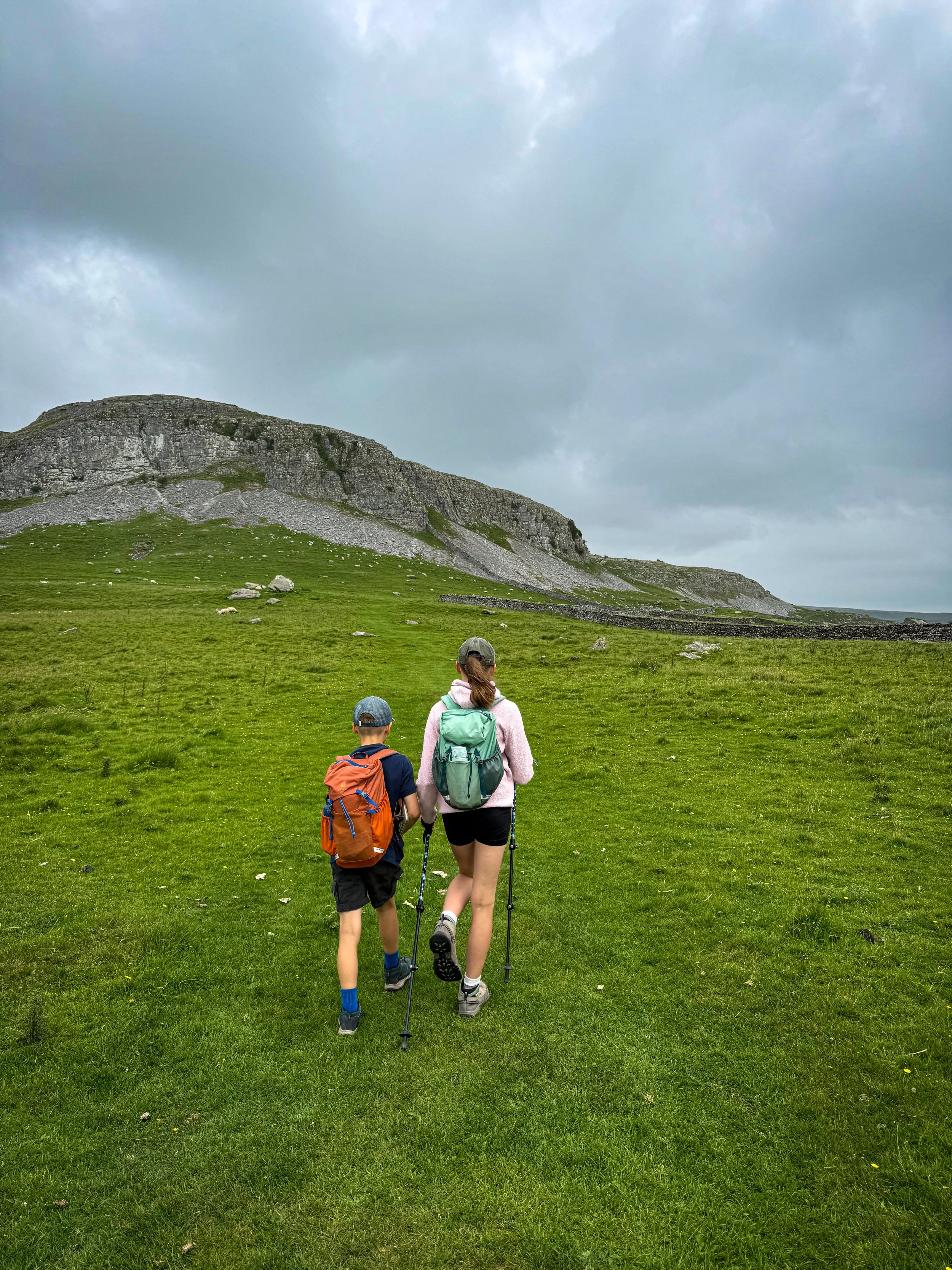 Two children walking towards Robin Proctor's Scar