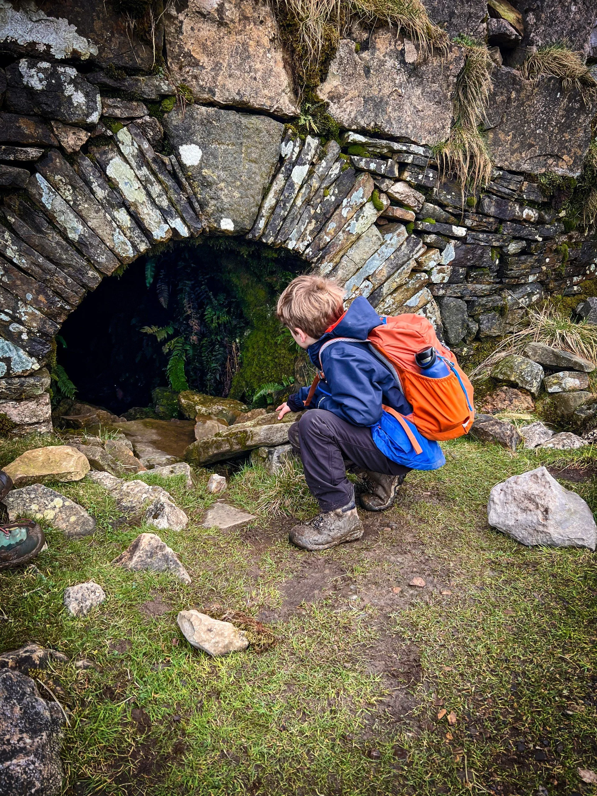 Crouching next to the Buckden Gavel mine entrance