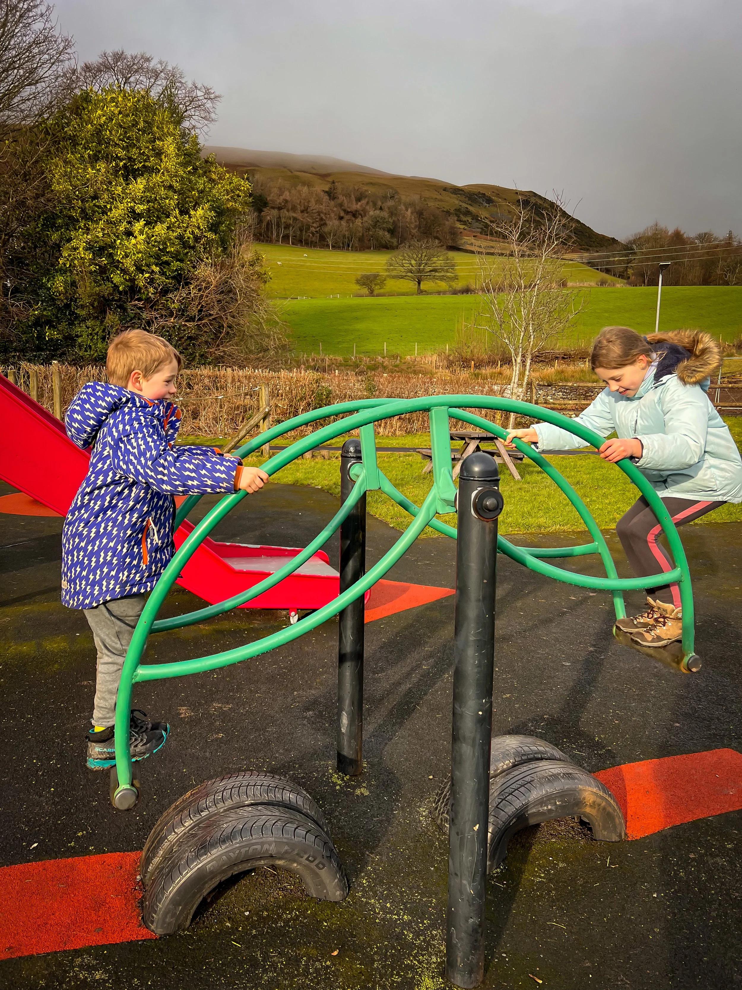 Jumping on the seesaw at the park in Sedbergh