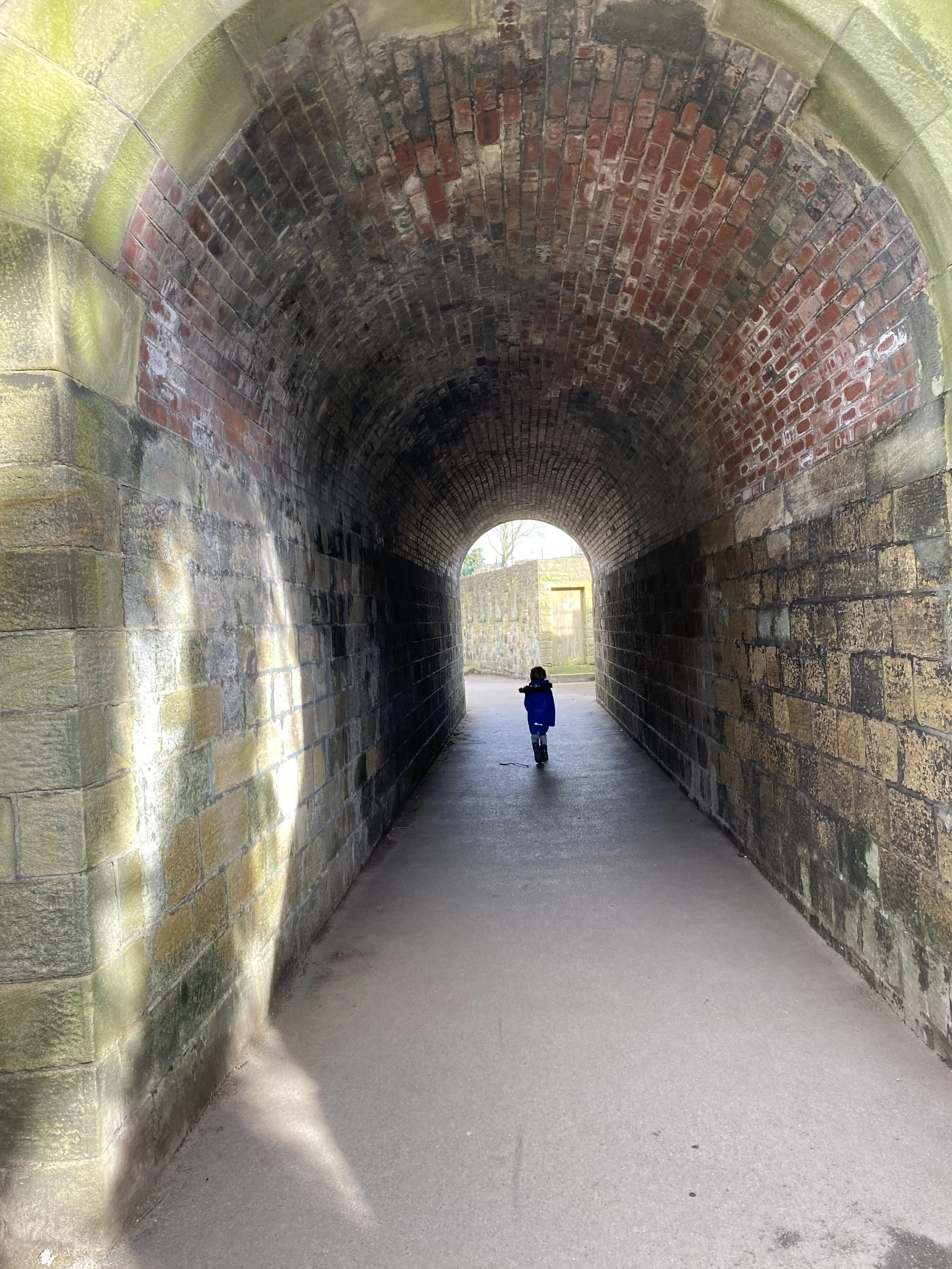 Child walking through the underpass